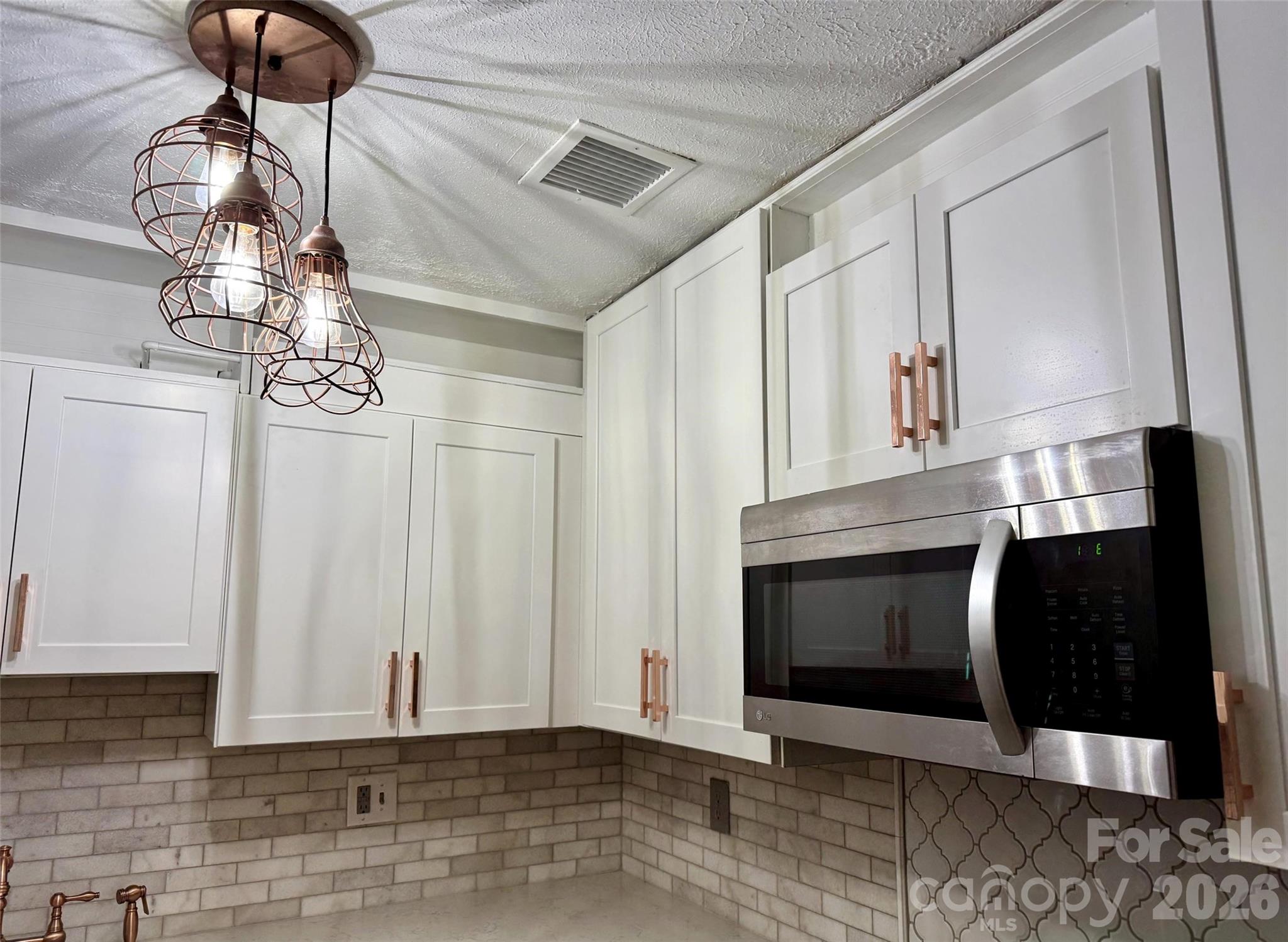 New lighting, microwave, cabinets. - 427 6th Avenue W, Hendersonville