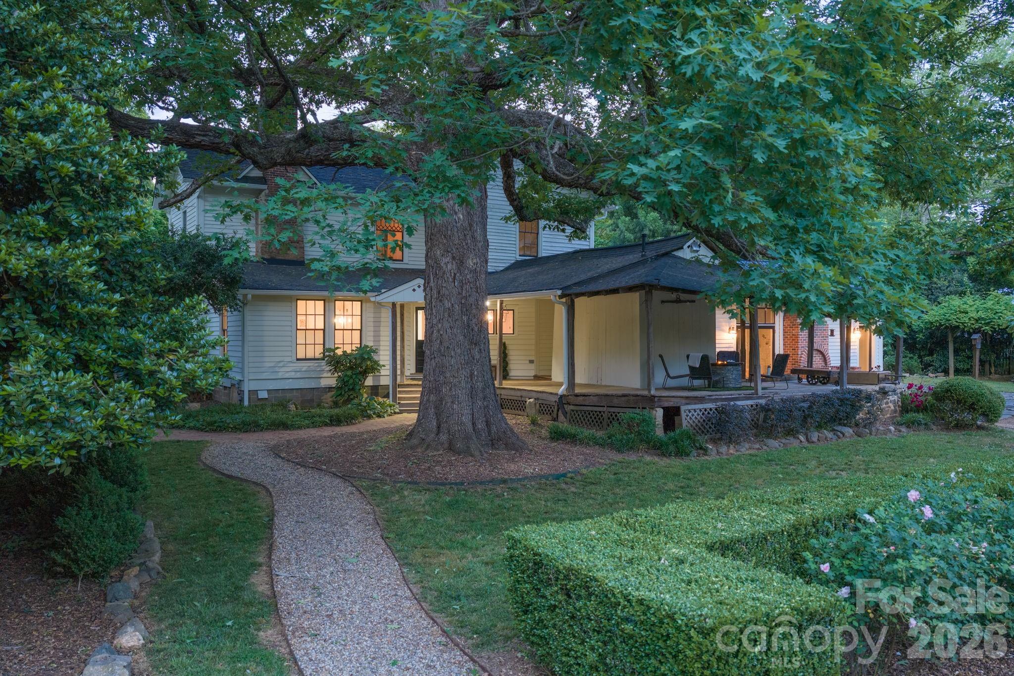 Surrounded by a Master Gardener's creation and nature's history, gardens & hardwood canopy. - 10915 Beatties Ford Road, Huntersville