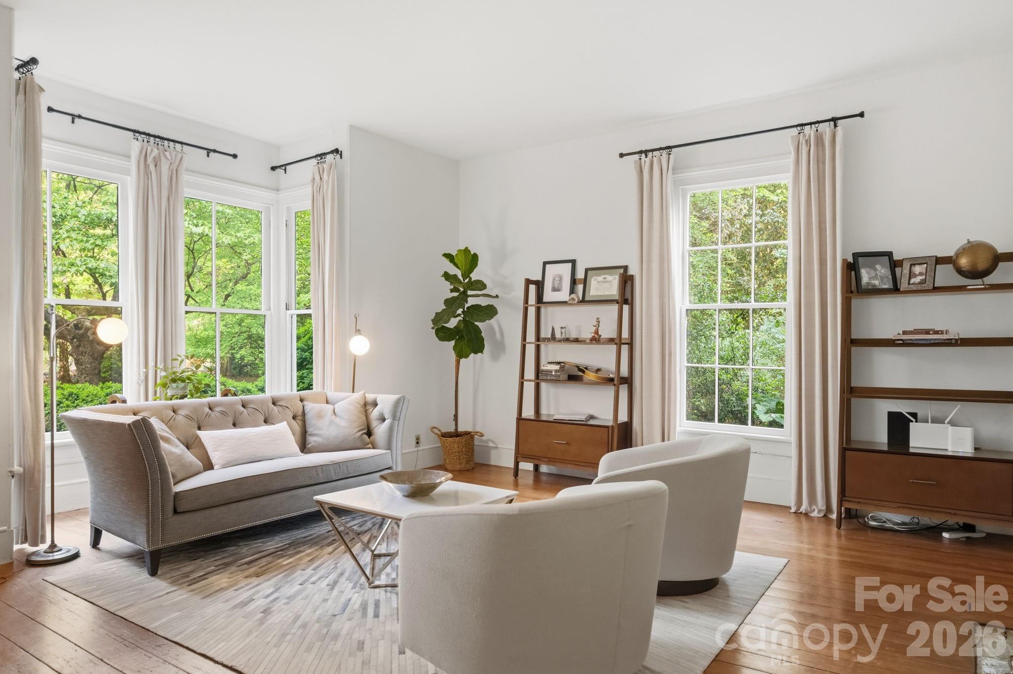 Just off the foyer is what may have been the "Parlor" with the original bay window with sash windows and 6-pane over 6-pane side windows. - 10915 Beatties Ford Road, Huntersville
