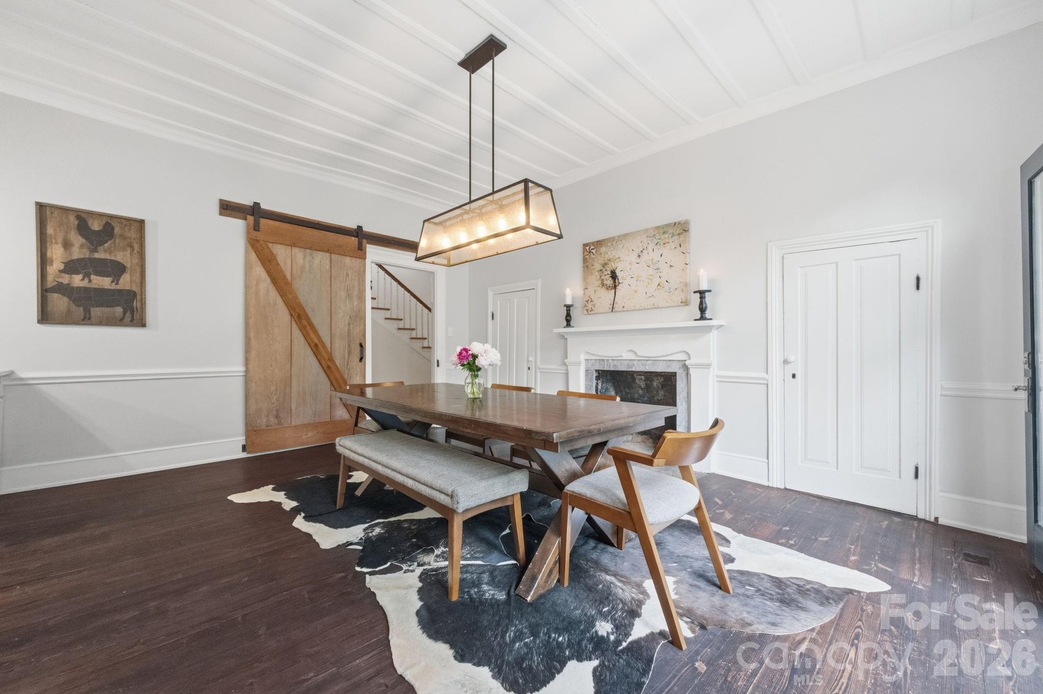 Original board-and-batten ceilings, barn door opening to central hall, chair railing. - 10915 Beatties Ford Road, Huntersville