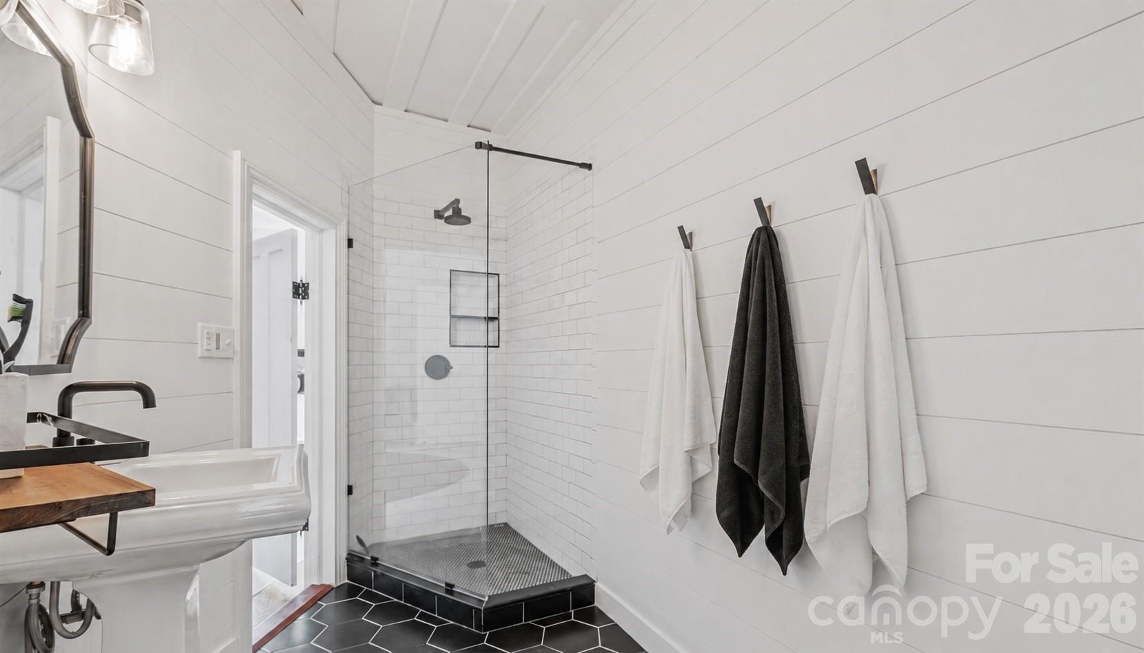 Tile floors, tile and frameless glass shower, music and lighting and shiplap walls. - 10915 Beatties Ford Road, Huntersville