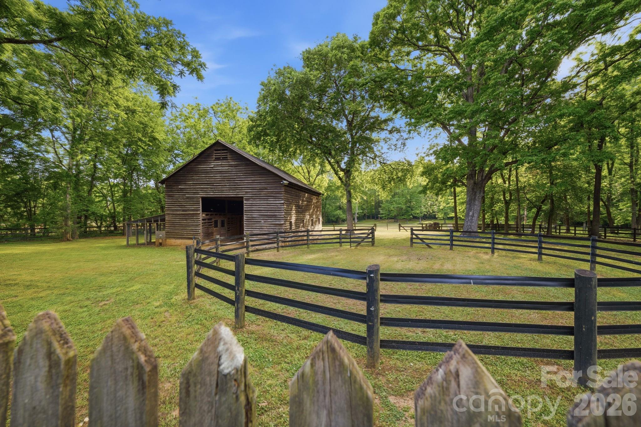 Barn situated next to the pastures and round pen. - 10915 Beatties Ford Road, Huntersville