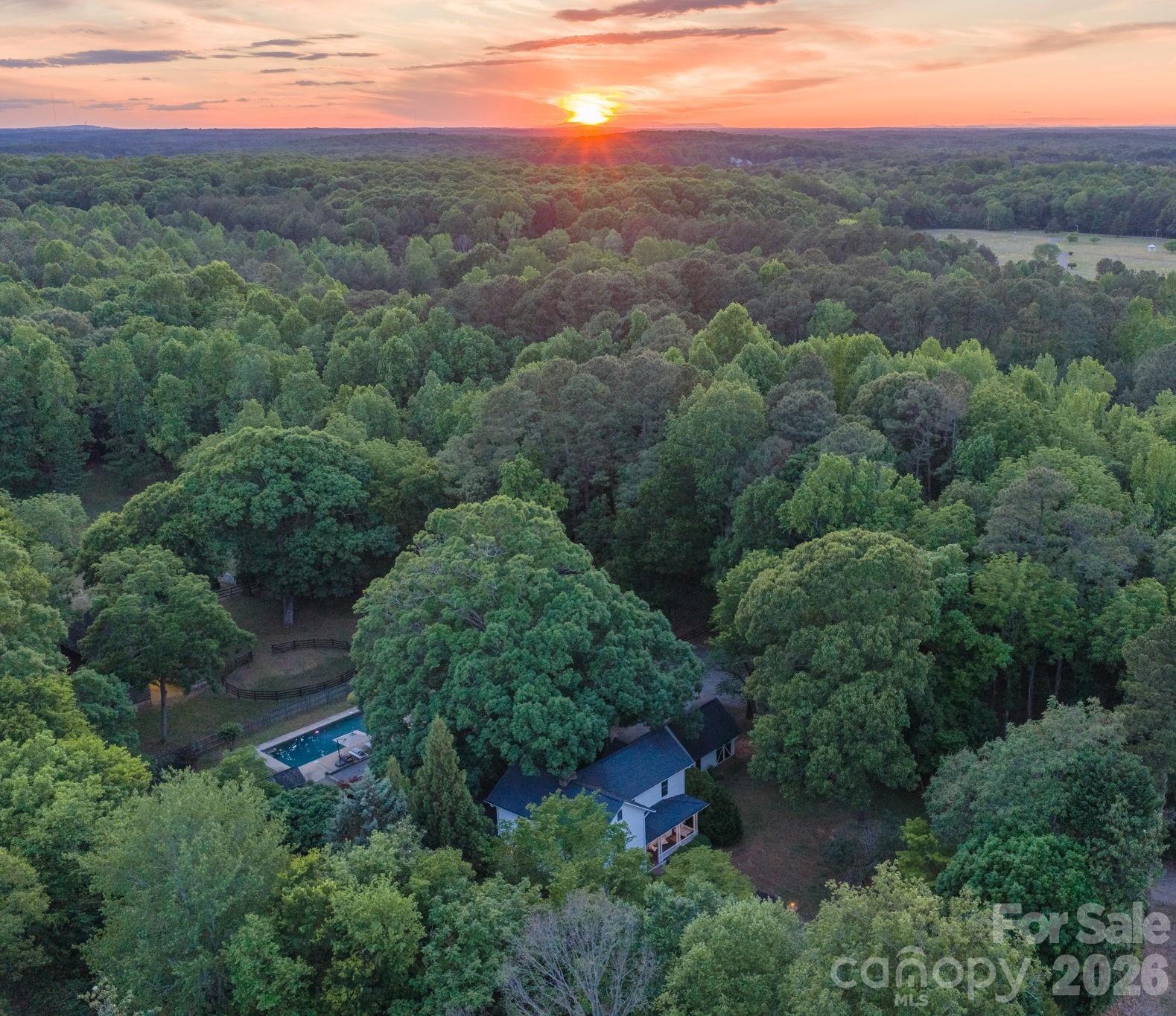 The canopy provided by the oaks ensures your privacy and sense of being away from it all, yet you are located within 10 minutes of Birkdale Village and Lake Norman. - 10915 Beatties Ford Road, Huntersville