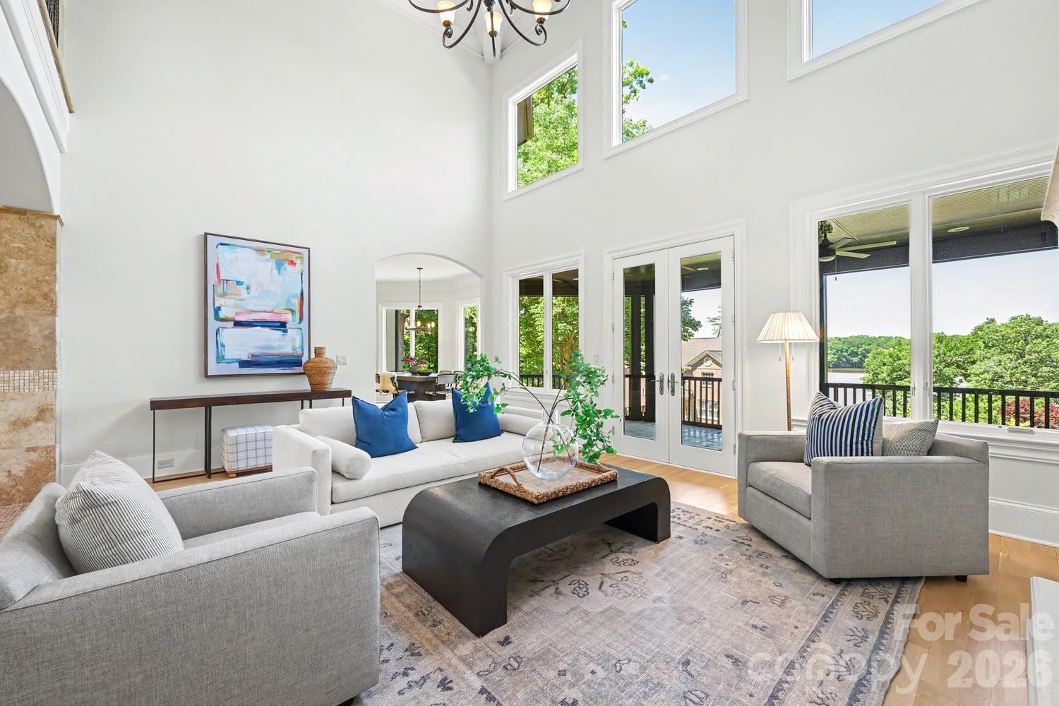 Great Room with water views has french door to veranda - 8041 Water View Drive, Belmont