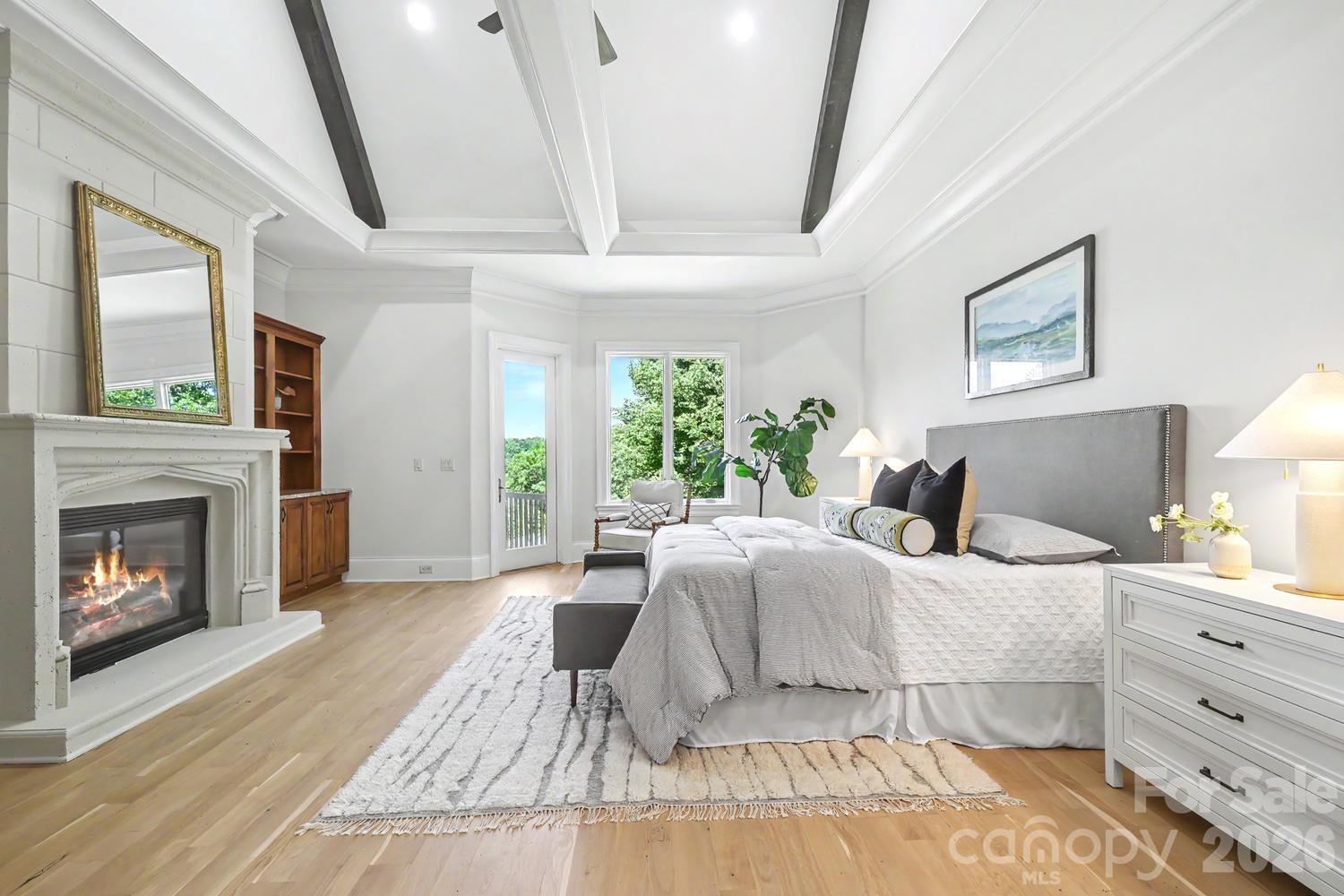 Main level primary with fireplace - 8041 Water View Drive, Belmont
