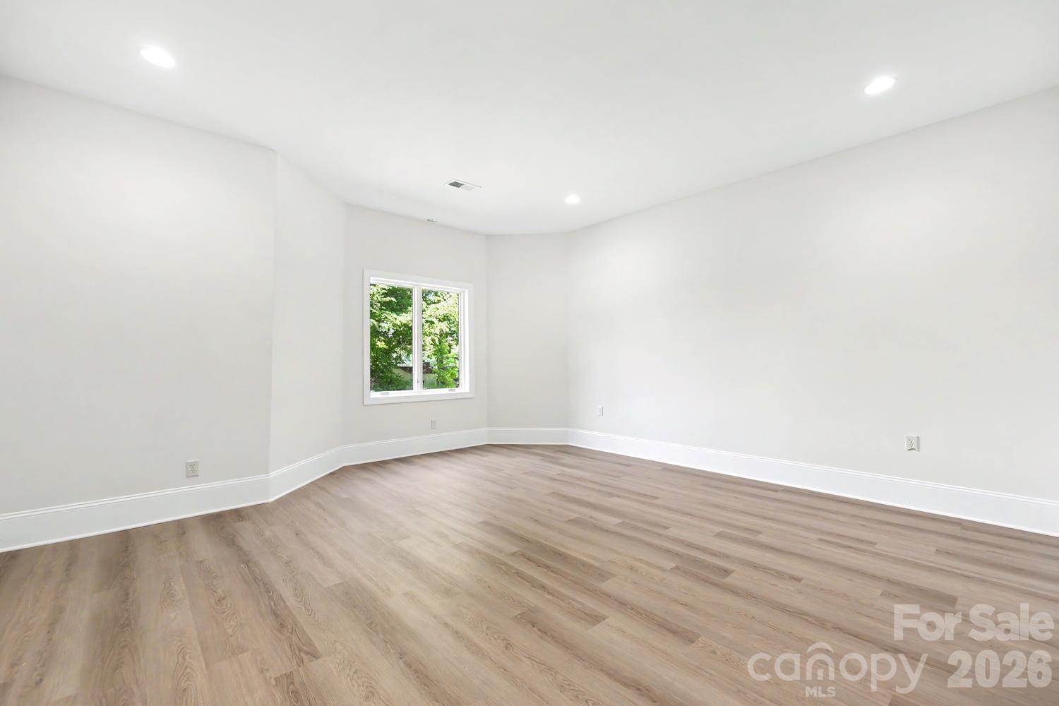 Lower level bedroom with large walk-in closet - 8041 Water View Drive, Belmont