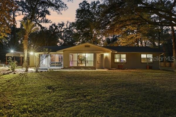 Dusk front of home - 3630 NW 136TH ST, GAINESVILLE