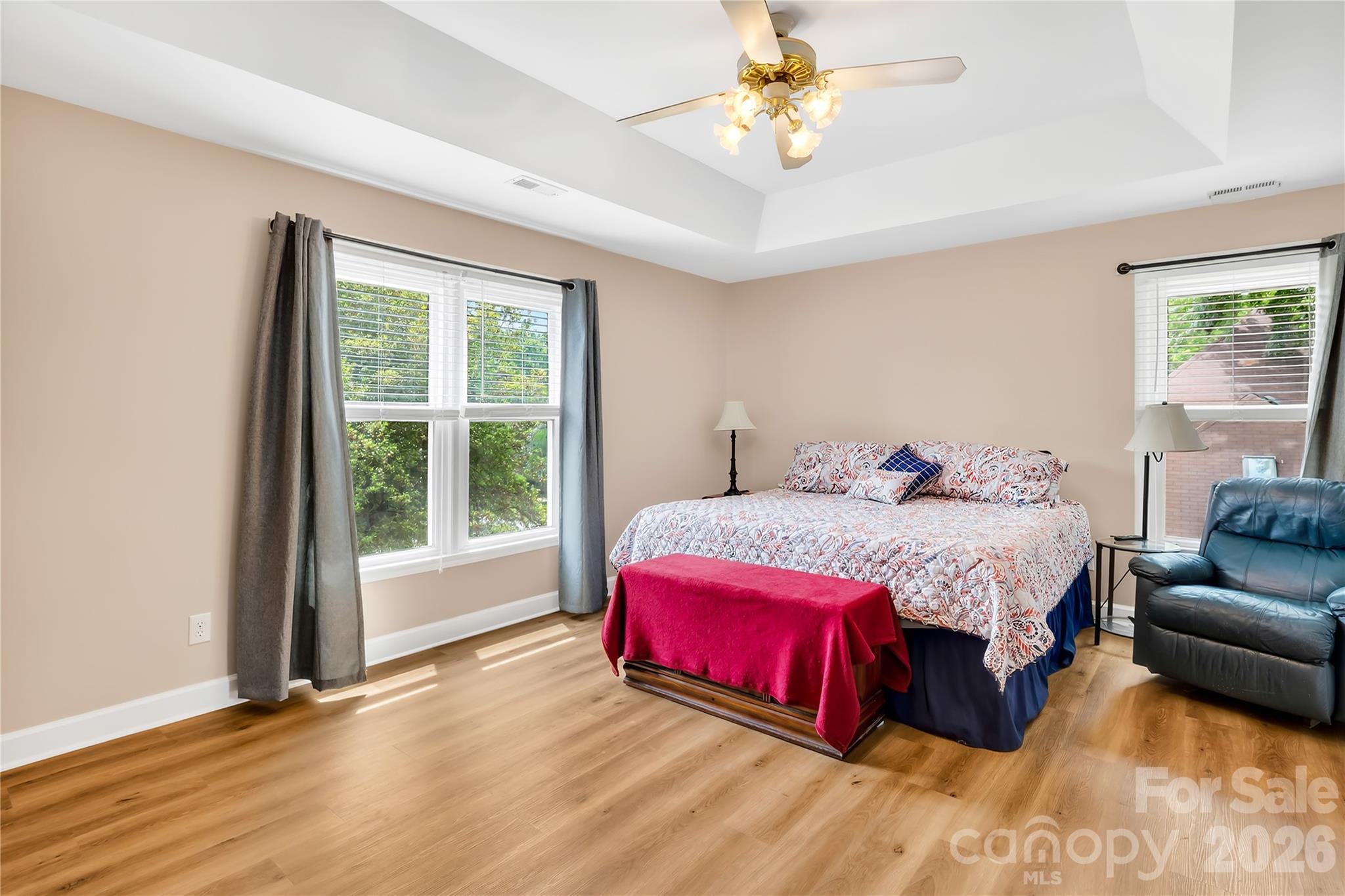 Primary Bedroom with a deep tray ceiling - 1066 Briarcliff Road, Mooresville