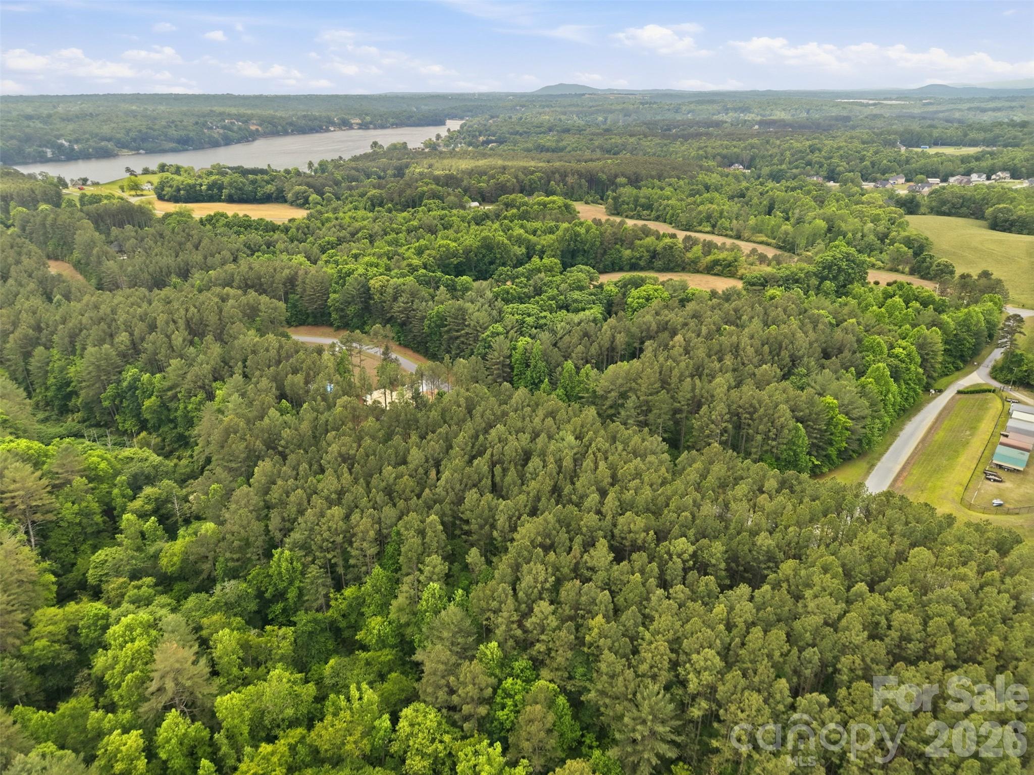 Acres of hardwood canopy define the community - 6020 Plantation Pointe Drive, Granite Falls