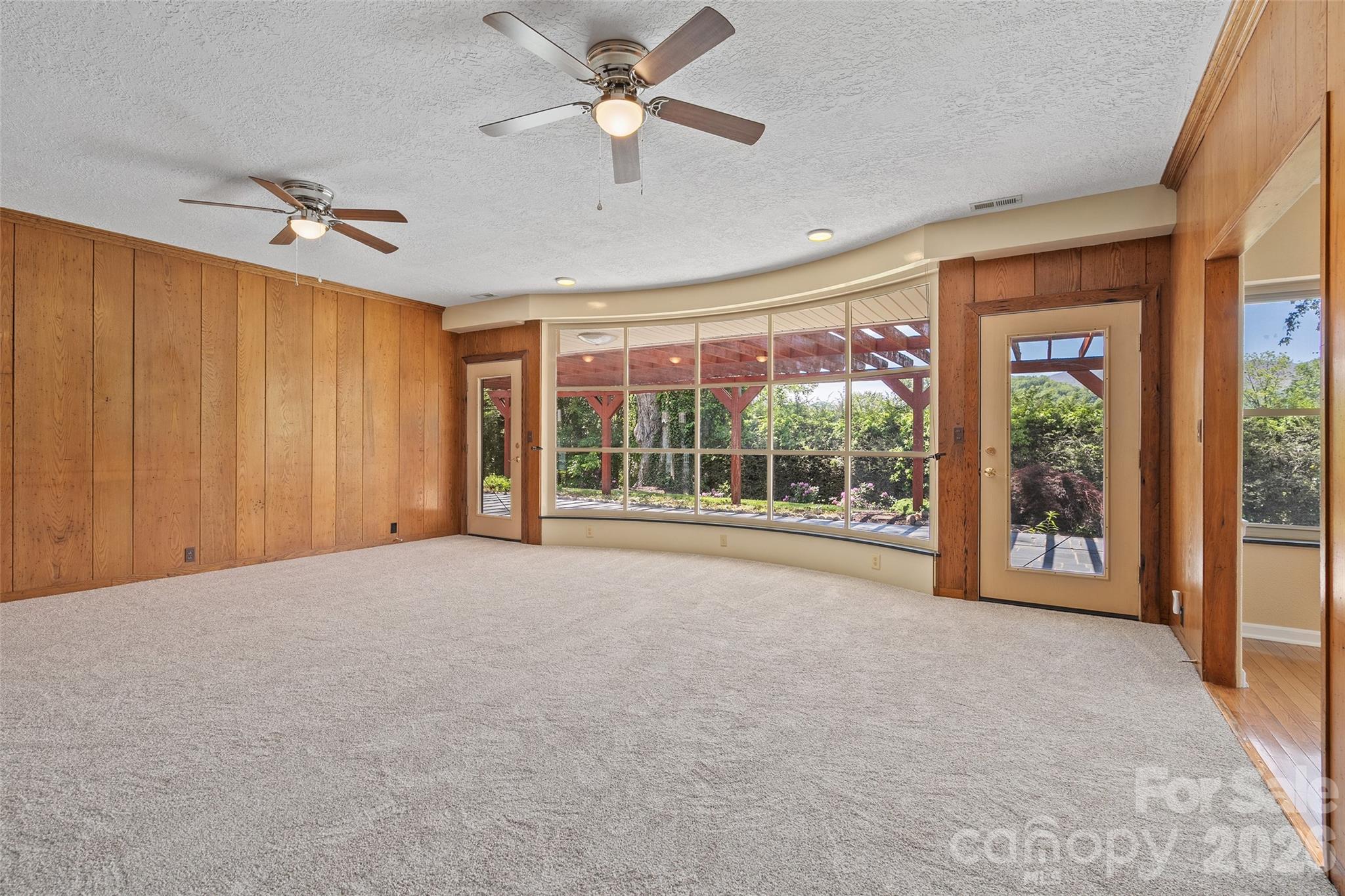 Living Room with walkout to the back deck. - 142 Country Club Drive, Waynesville