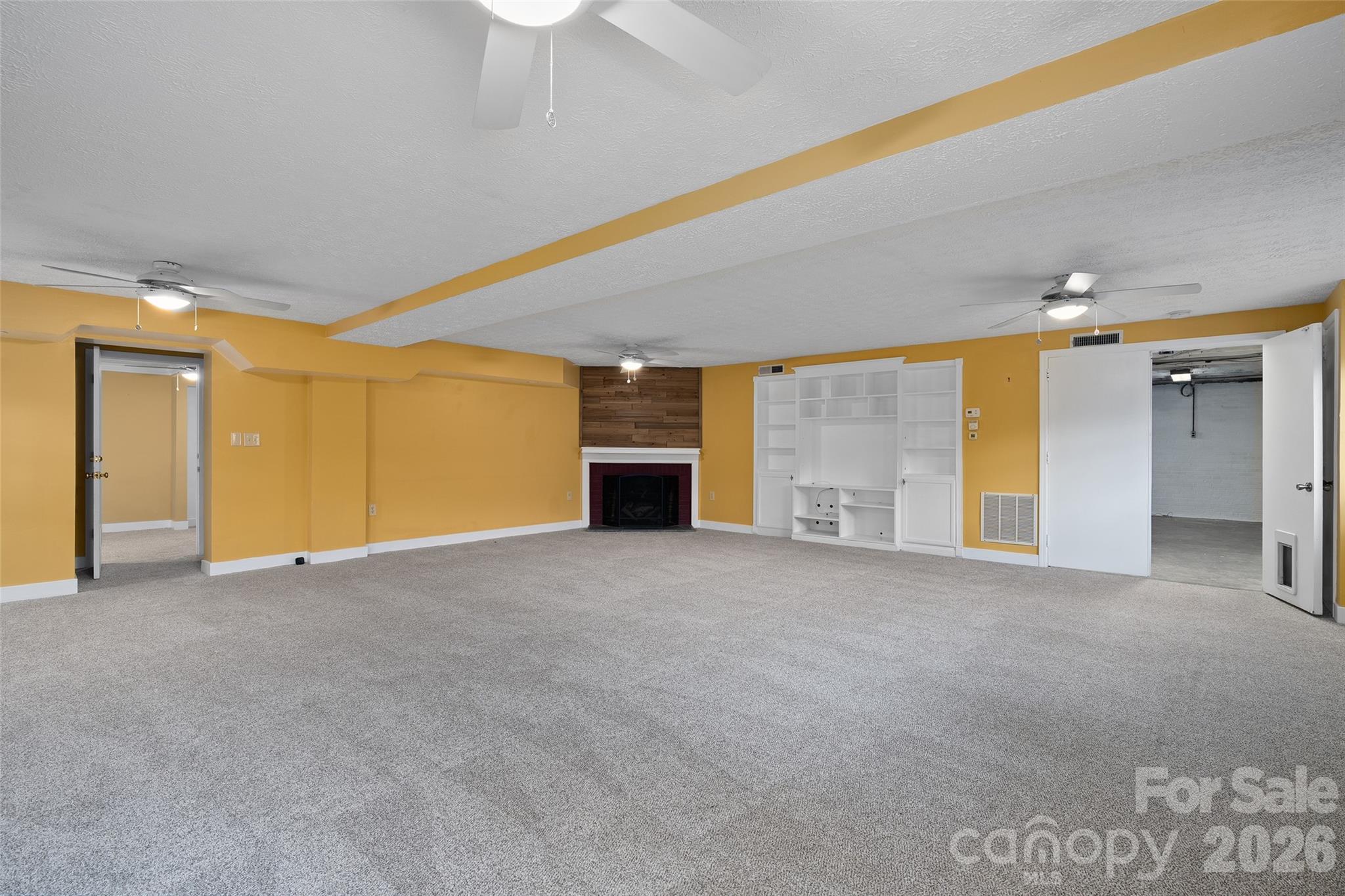 Downstairs quarters rec room with fireplace - 142 Country Club Drive, Waynesville