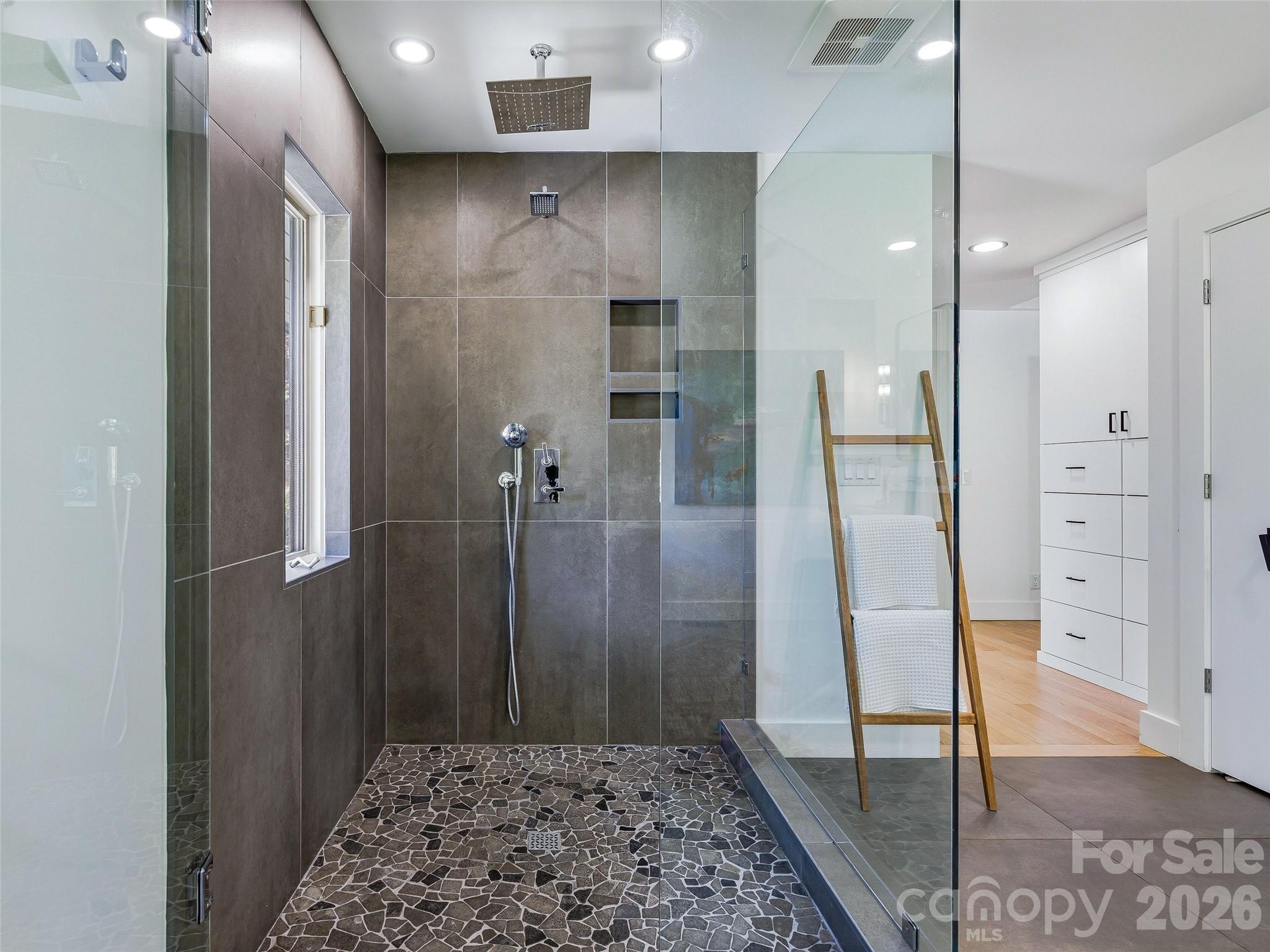Frameless glass corner shower with House of Rohl rainfall, fixed, and handheld shower heads. - 100 Big Spring Drive, Asheville