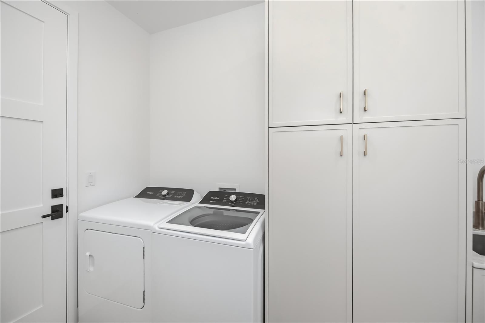 Spacious Laundry Room with Utility Sink and Ample Storage. - 16692 LIGGETT CIR, PORT CHARLOTTE