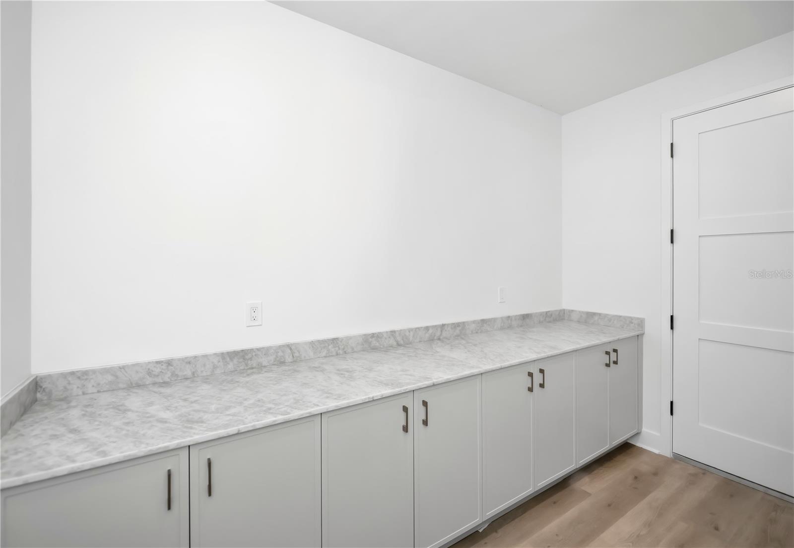 Spacious Laundry Room with Utility Sink and Ample Storage. - 16692 LIGGETT CIR, PORT CHARLOTTE