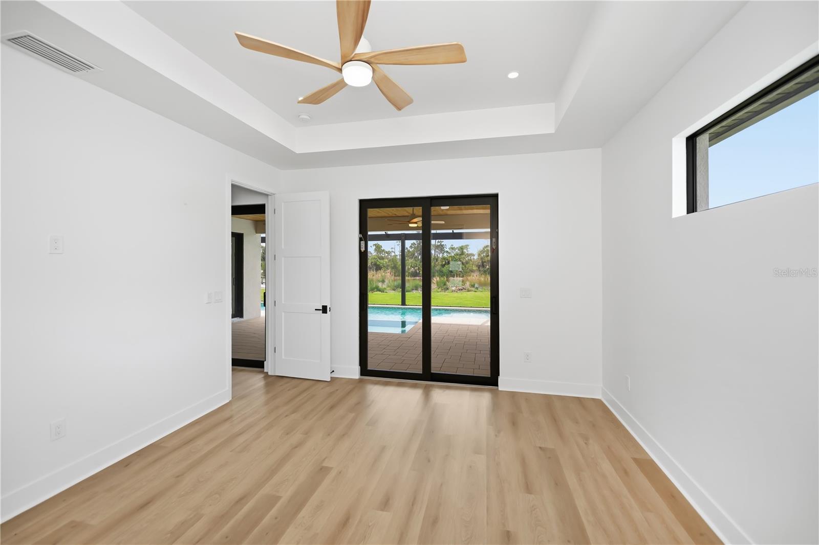 Primary Bedroom Suite with Beautiful Pool and Preserve Views. - 16692 LIGGETT CIR, PORT CHARLOTTE