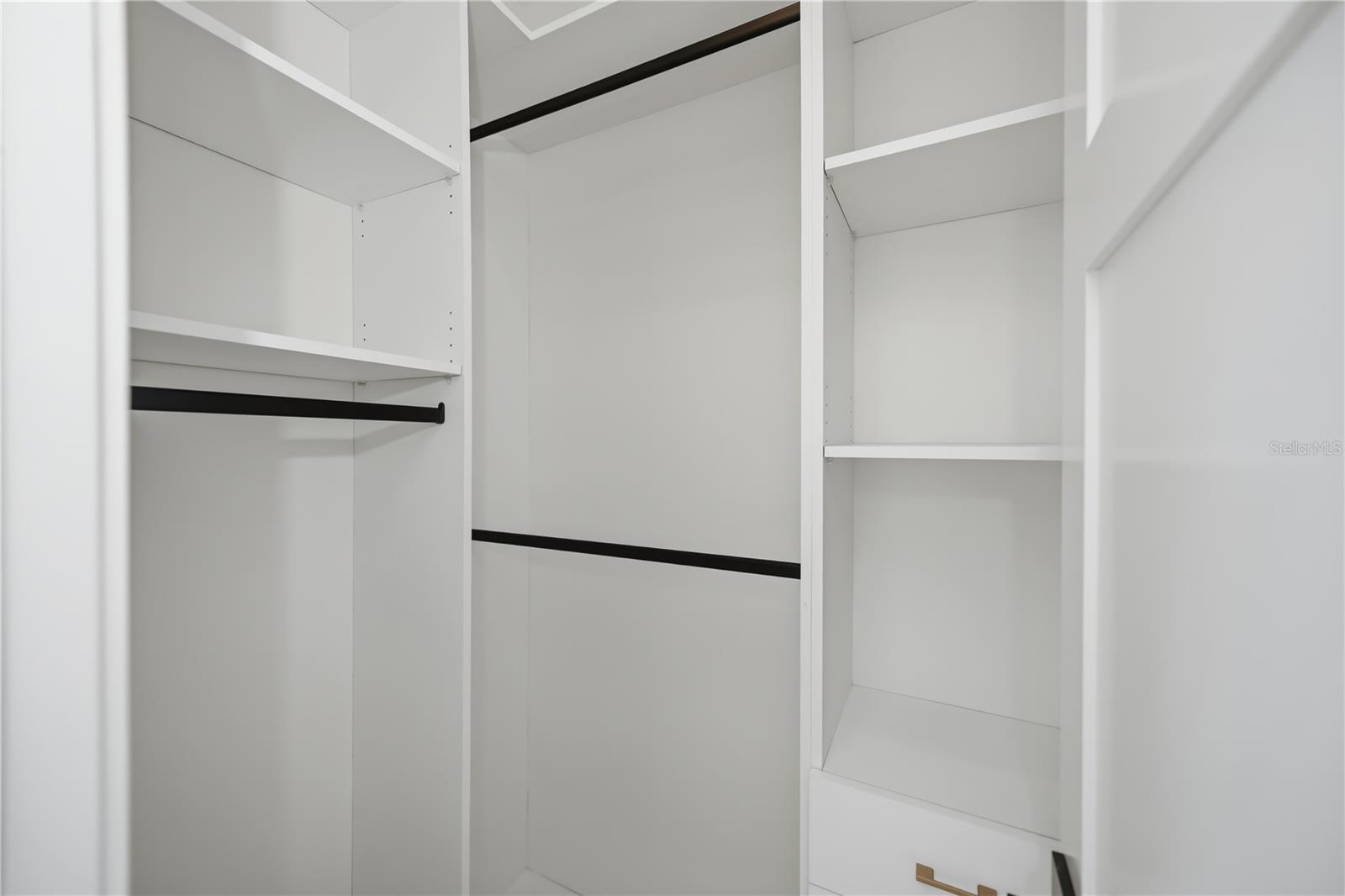 Walk in California Cabinetry in Guest Bedroom 2 & 3 closets. - 16692 LIGGETT CIR, PORT CHARLOTTE