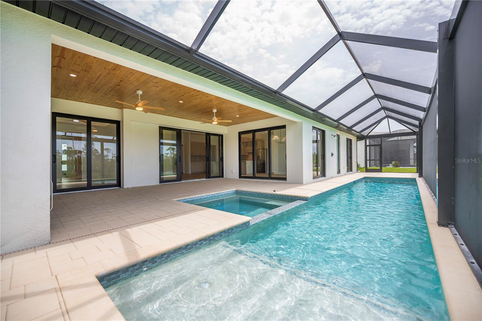 Expansive Screened Pool Overlooking Water Views. - 16692 LIGGETT CIR, PORT CHARLOTTE