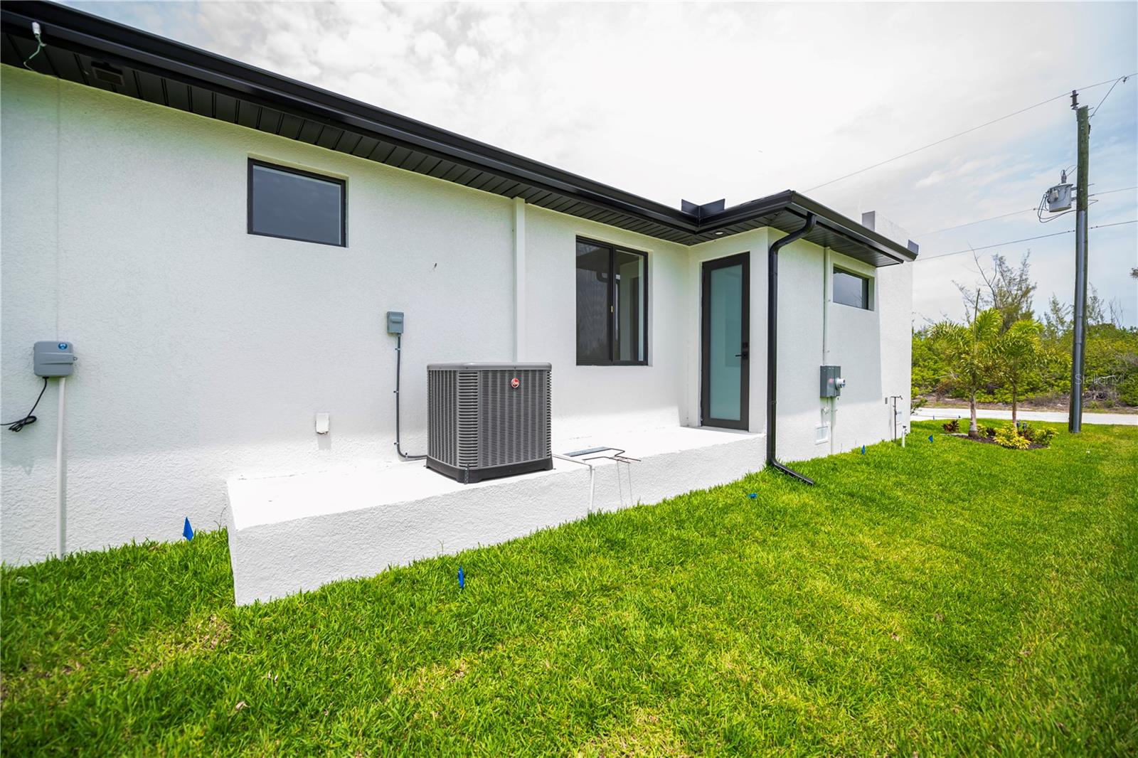 Convenient Exterior Access and Utility Area. - 16692 LIGGETT CIR, PORT CHARLOTTE