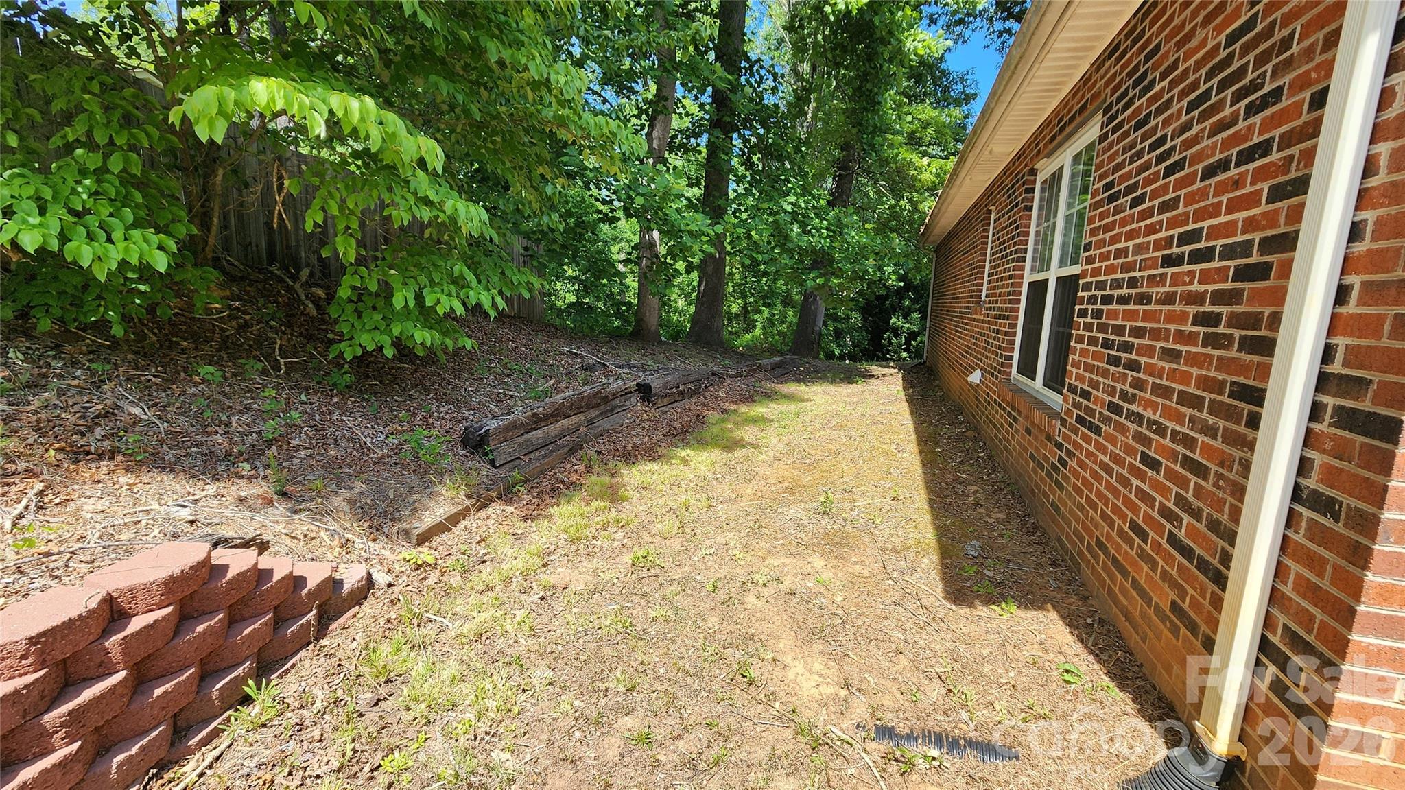 Rear Elevation has partial privacy fence - 200 Park Place, Morganton