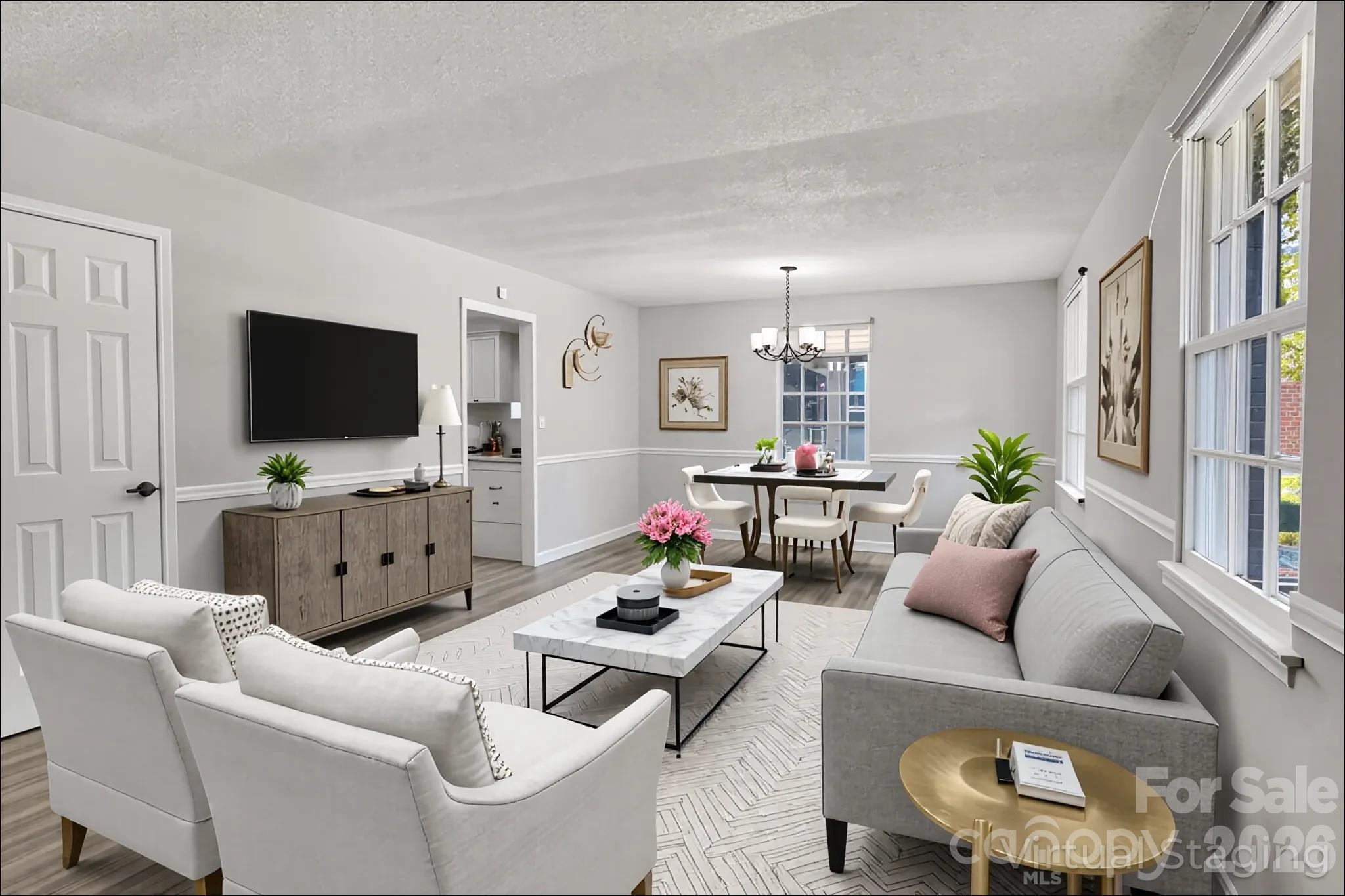 Opening the door and walking into the living room (virtually staged & enhanced). - 3637 Glenville Avenue, Charlotte