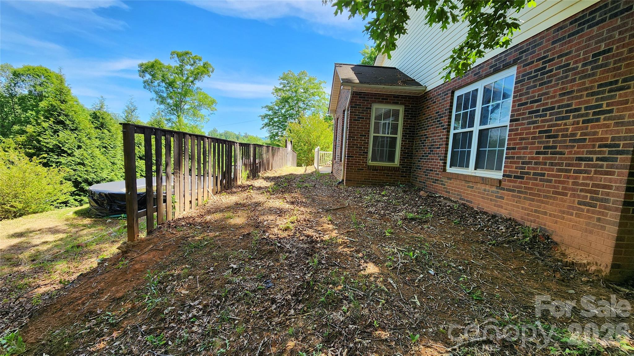 Right side elevation. Pool is located here. Access from side door to the pool. - 200 Park Place, Morganton