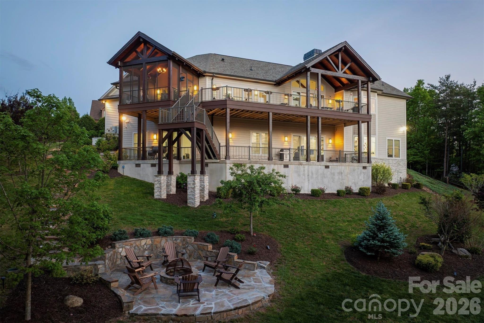 The deep concrete lower level porch spans the back of the house offering a versatile footprint for an outdoor lounge, alfresco dining, a private hot tub retreat, and more.The deep concrete lower level porch spans the back of the house offering a versatile footprint for an outdoor lounge, alfresco dining, a private hot tub retreat, and more. A propane gas line is run to this area, ready to hook up a grill, gas fire pit, or hot tub - 1506 High Valley Way, Lenoir