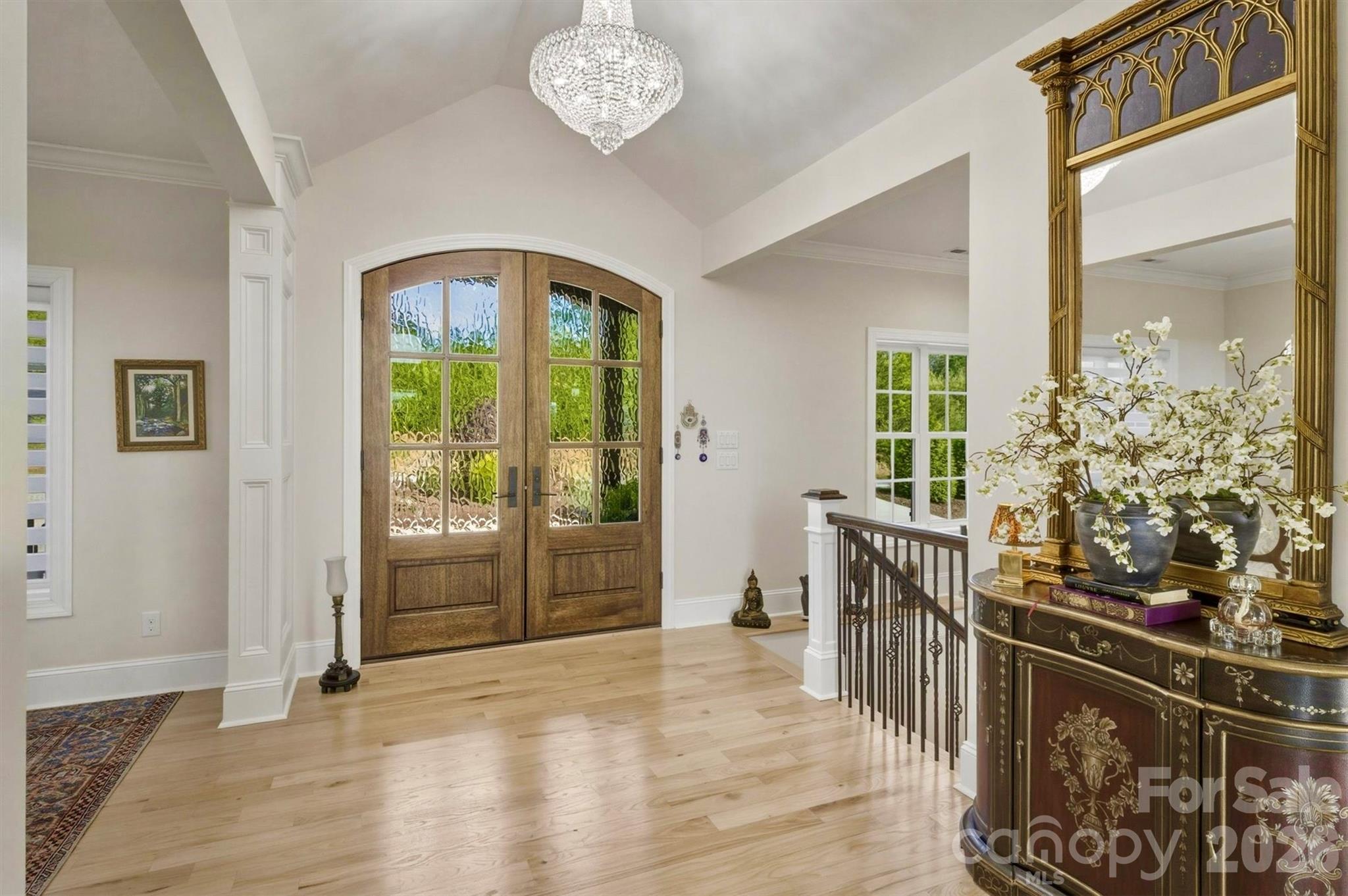 The grand foyer illuminated by a Swarovski Crystal Chandelier - 1506 High Valley Way, Lenoir