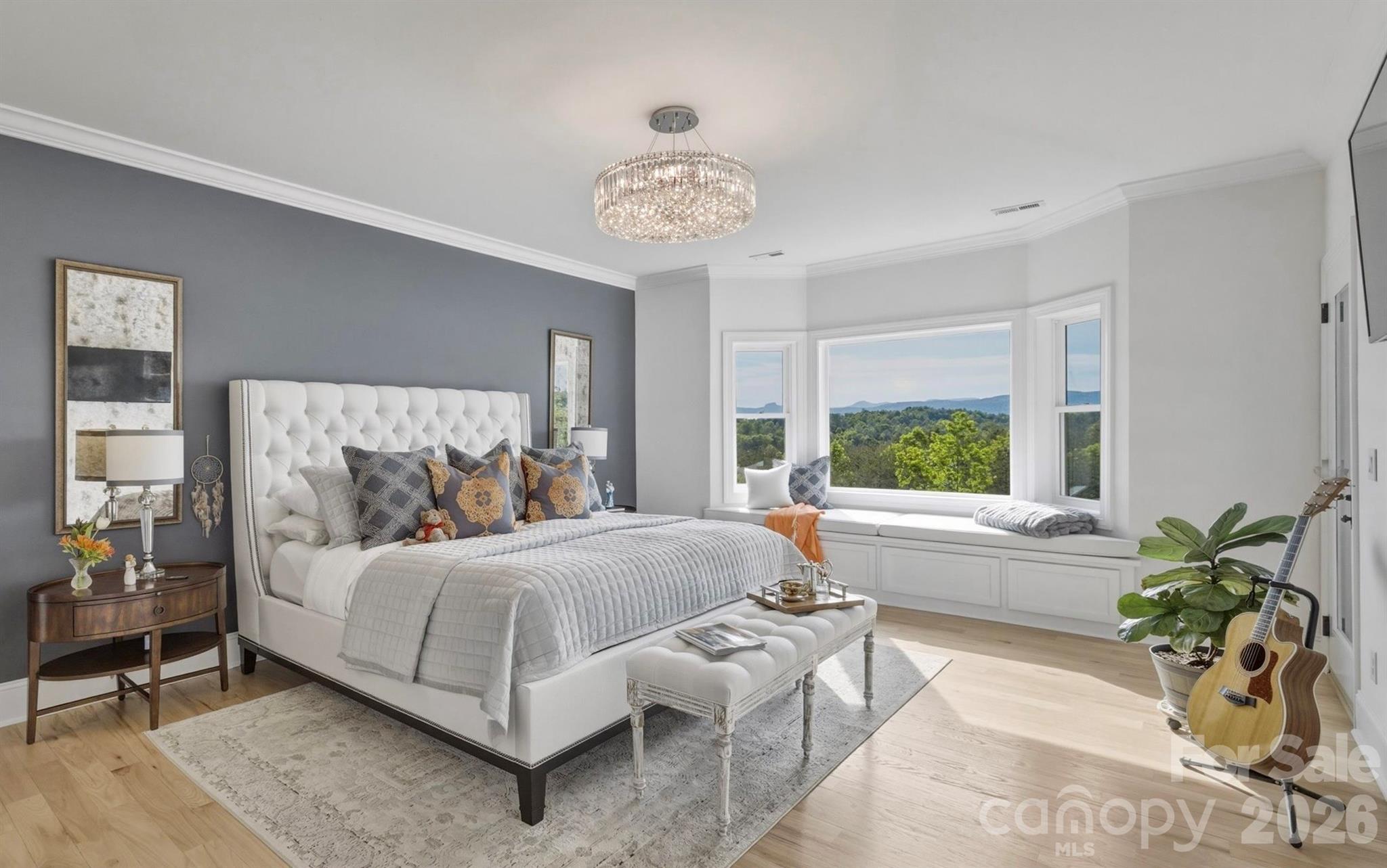 The ensuite primary bedroom has dramatic Blue Ridge Mountain views. - 1506 High Valley Way, Lenoir