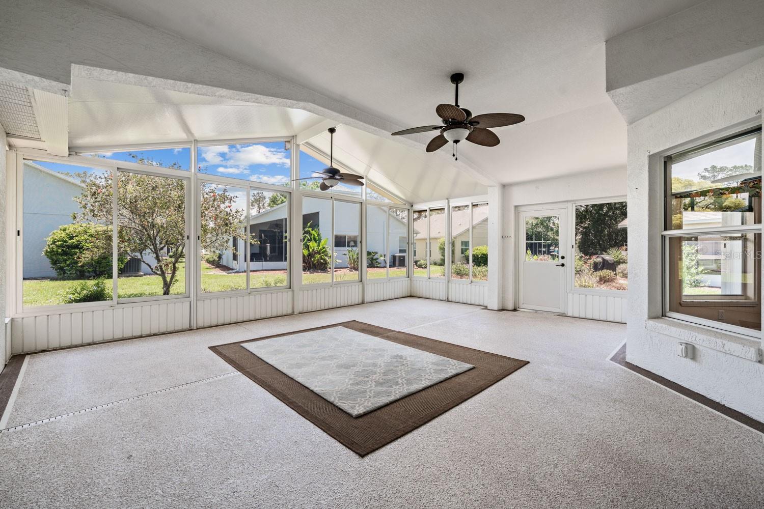 16x24 enclosed air conditioned Florida room - 11709 SPINDRIFT LOOP, HUDSON