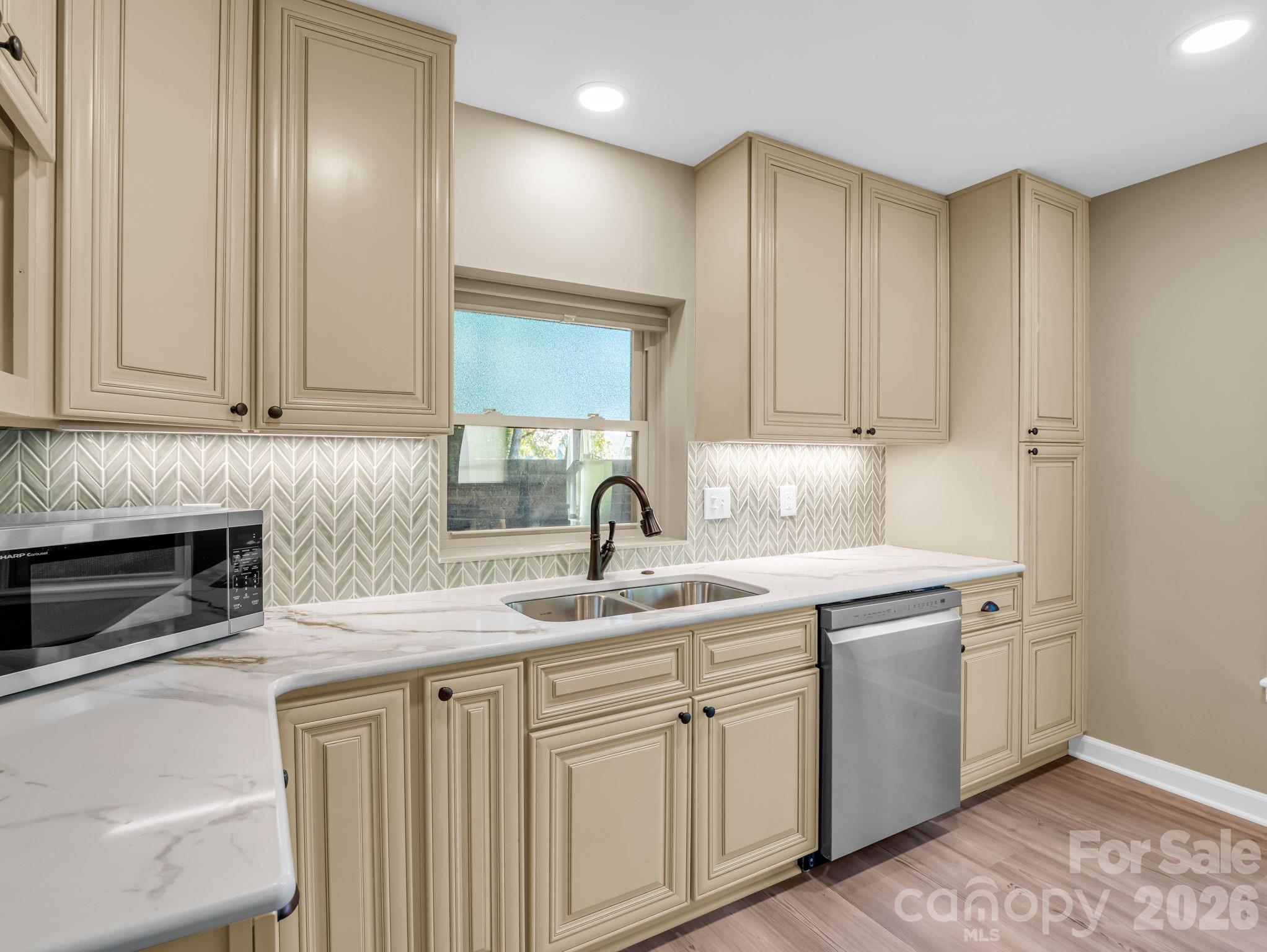 New quartz countertops and a double stainless steel sink. - 44 Jervey Road, Tryon