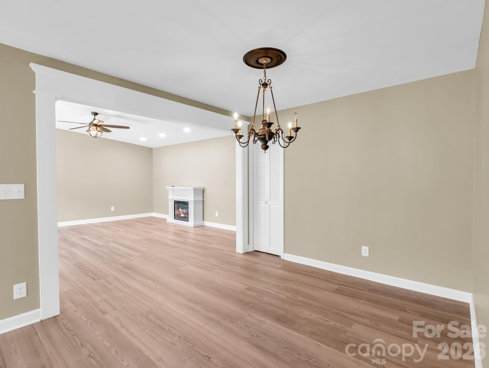 From the kitchen, looking back through the dining area to the living room. - 44 Jervey Road, Tryon