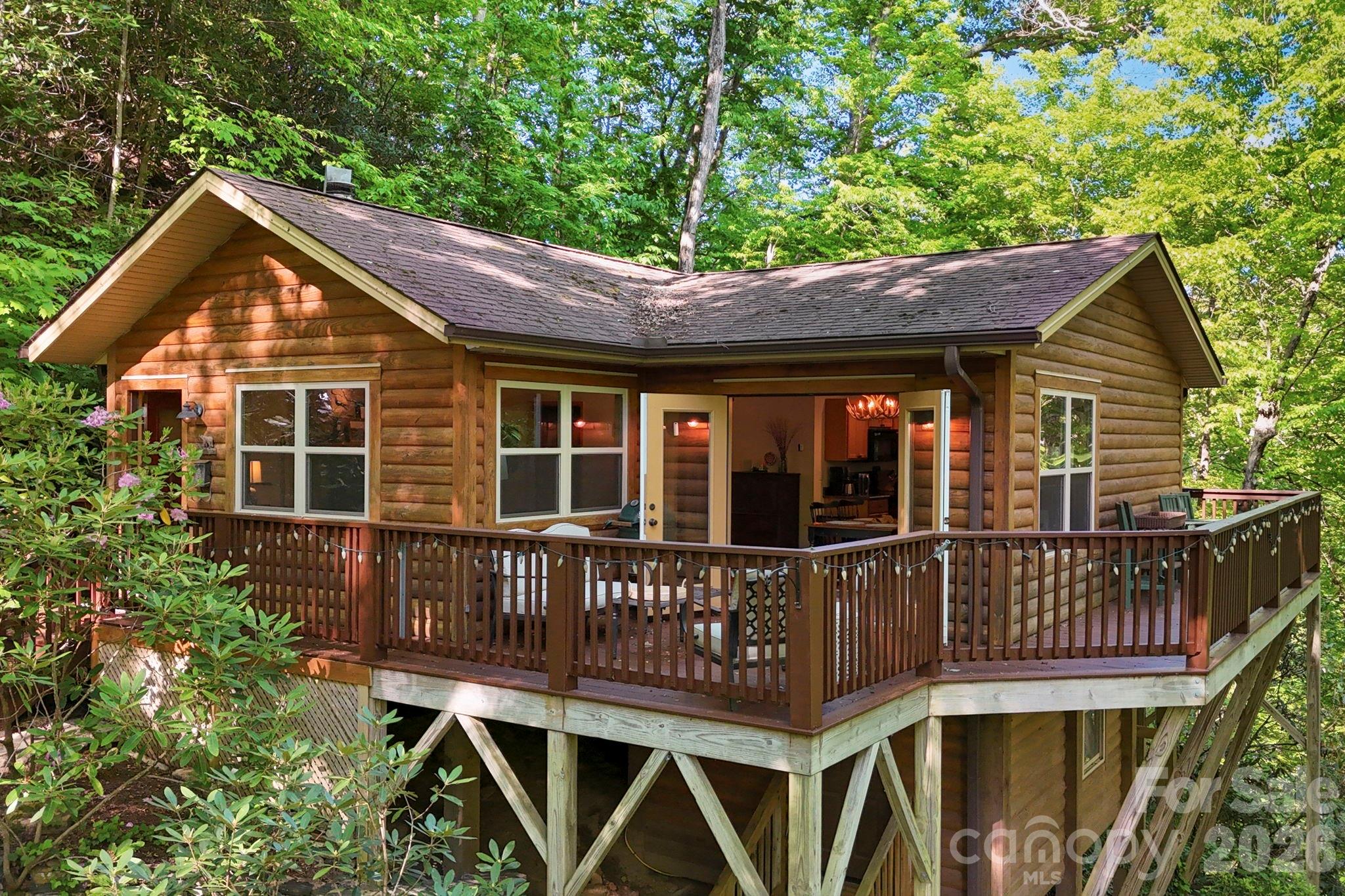 The best of Indoor/Outdoor Living overlooking the roaring creek. - 500 Winter Star Road, Burnsville