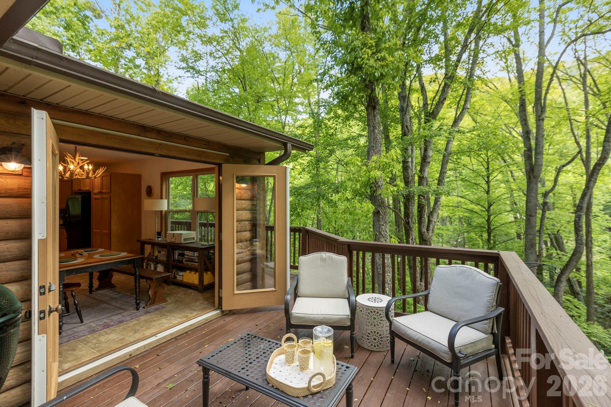 The deck overlooking the creek extends your living space. - 500 Winter Star Road, Burnsville