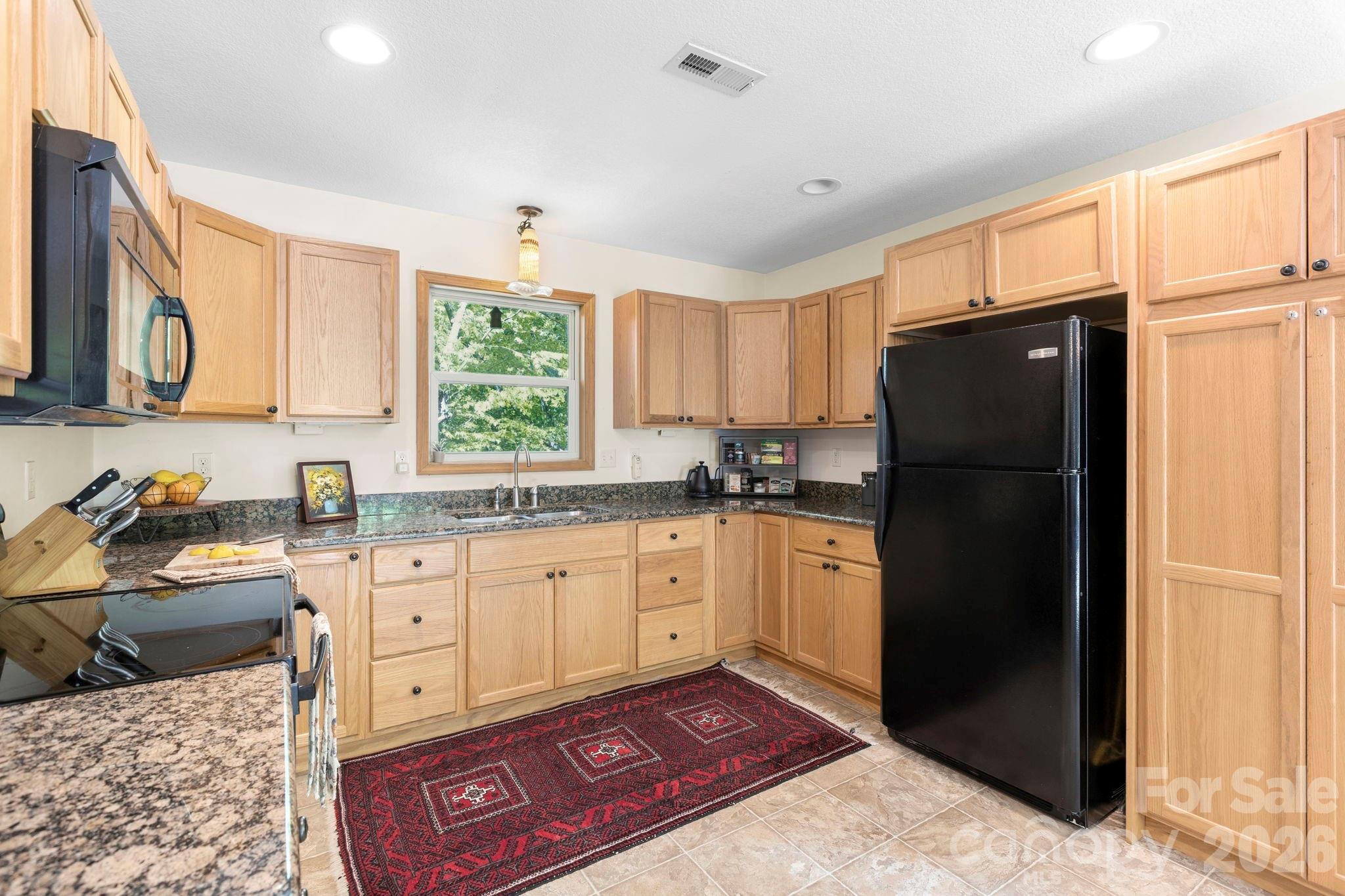 Tons of counter space & cabinetry w/ Double pantry cabinet - 500 Winter Star Road, Burnsville