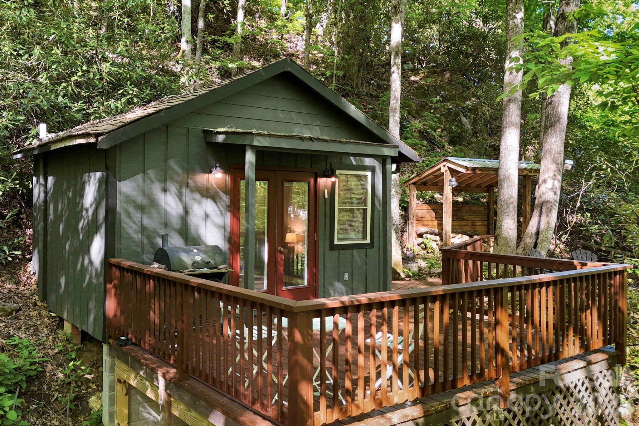 Bunkhouse connected to Main Cabin via easy path and Covered Wood storage along the way - 500 Winter Star Road, Burnsville