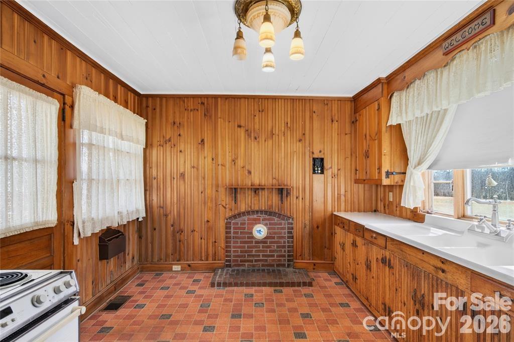 Kitchen has a large farmhouse sink and. big window overlooking the yard to the west. - 11124 Eastfield Road, Huntersville