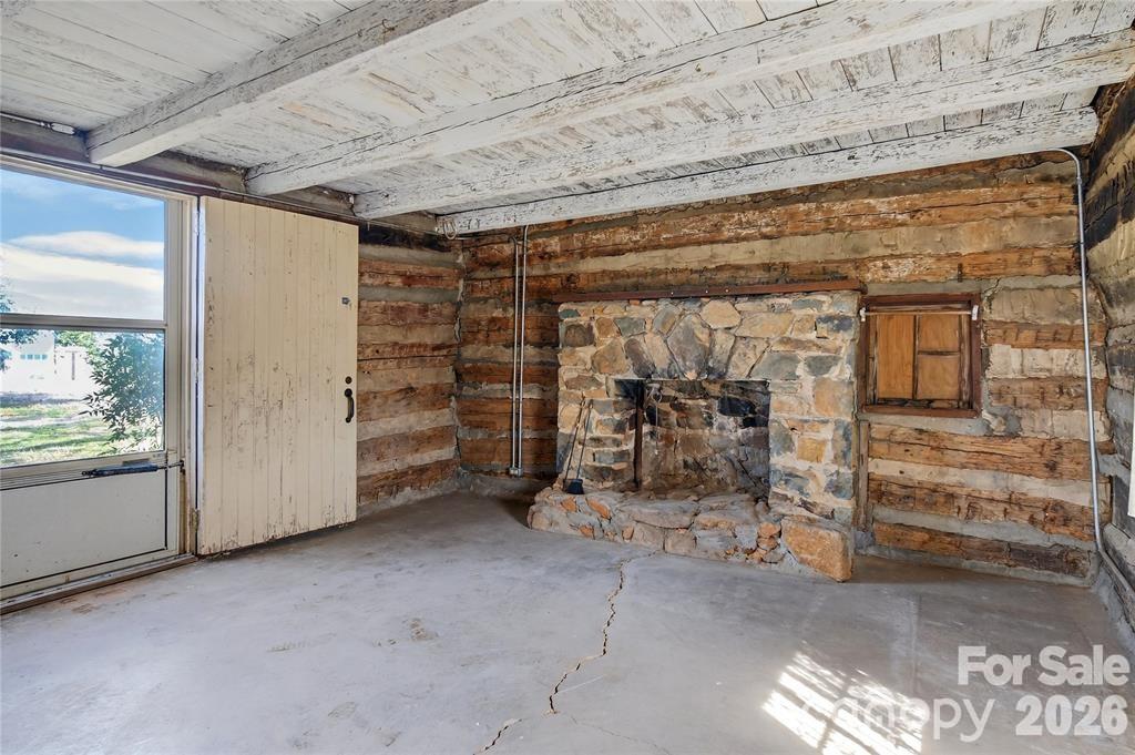 Stone fireplace in log home - 11124 Eastfield Road, Huntersville