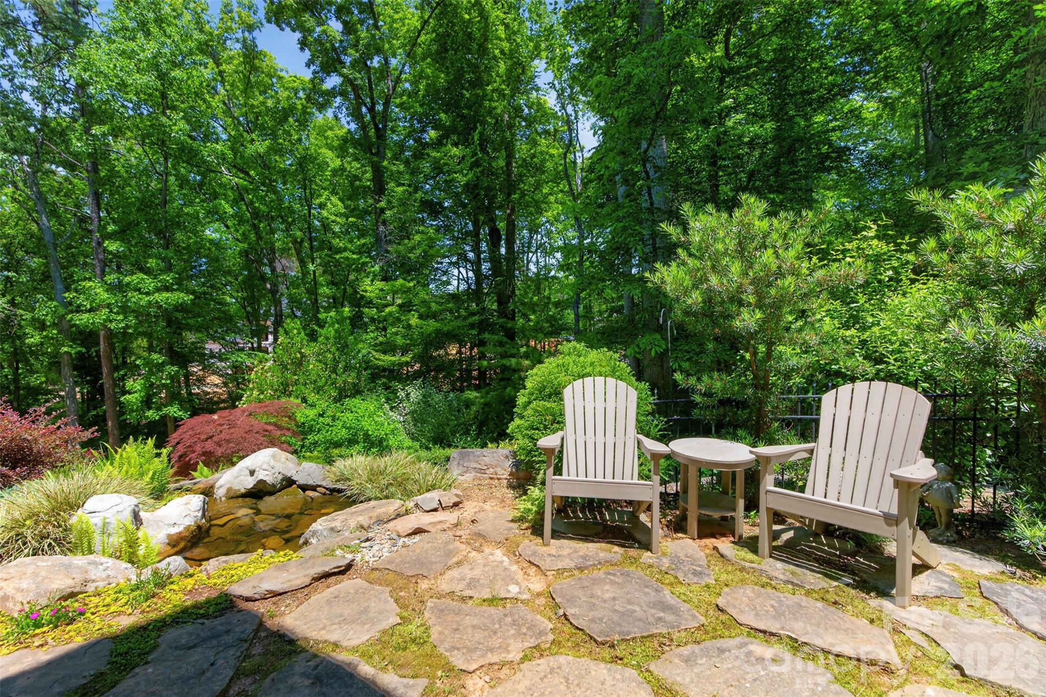 Lower Stone Patio with Water Fall Feature - 5138 Watermead Lane, Belmont