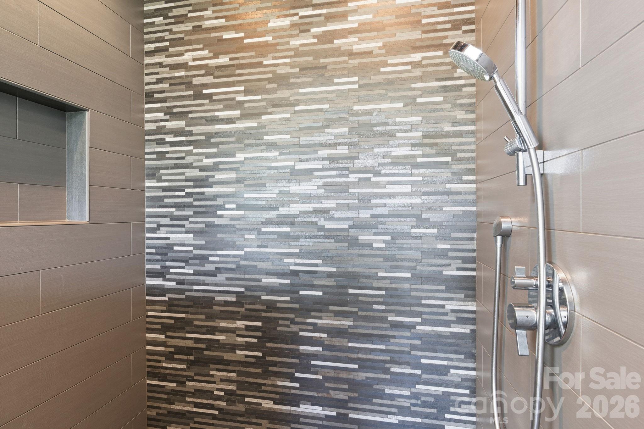 Artfully tiled standup shower in primary bathroom suite - 31 Bradford Vistas Drive, Fletcher
