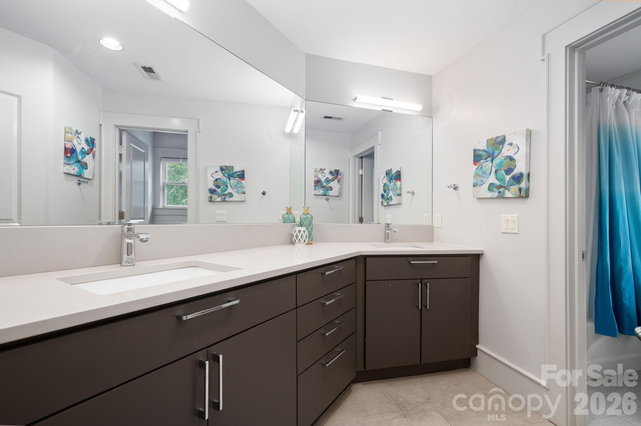 Upper level full bathroom with double sink vanity and tub/shower combo - 31 Bradford Vistas Drive, Fletcher