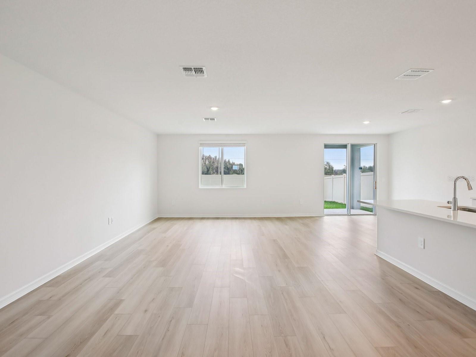 Interior photos are not of the actual home but are photos of the builder home with the same floorplan with similar interior finishes and features. - 10436 ABUNDANCE GROVE WAY, PARRISH