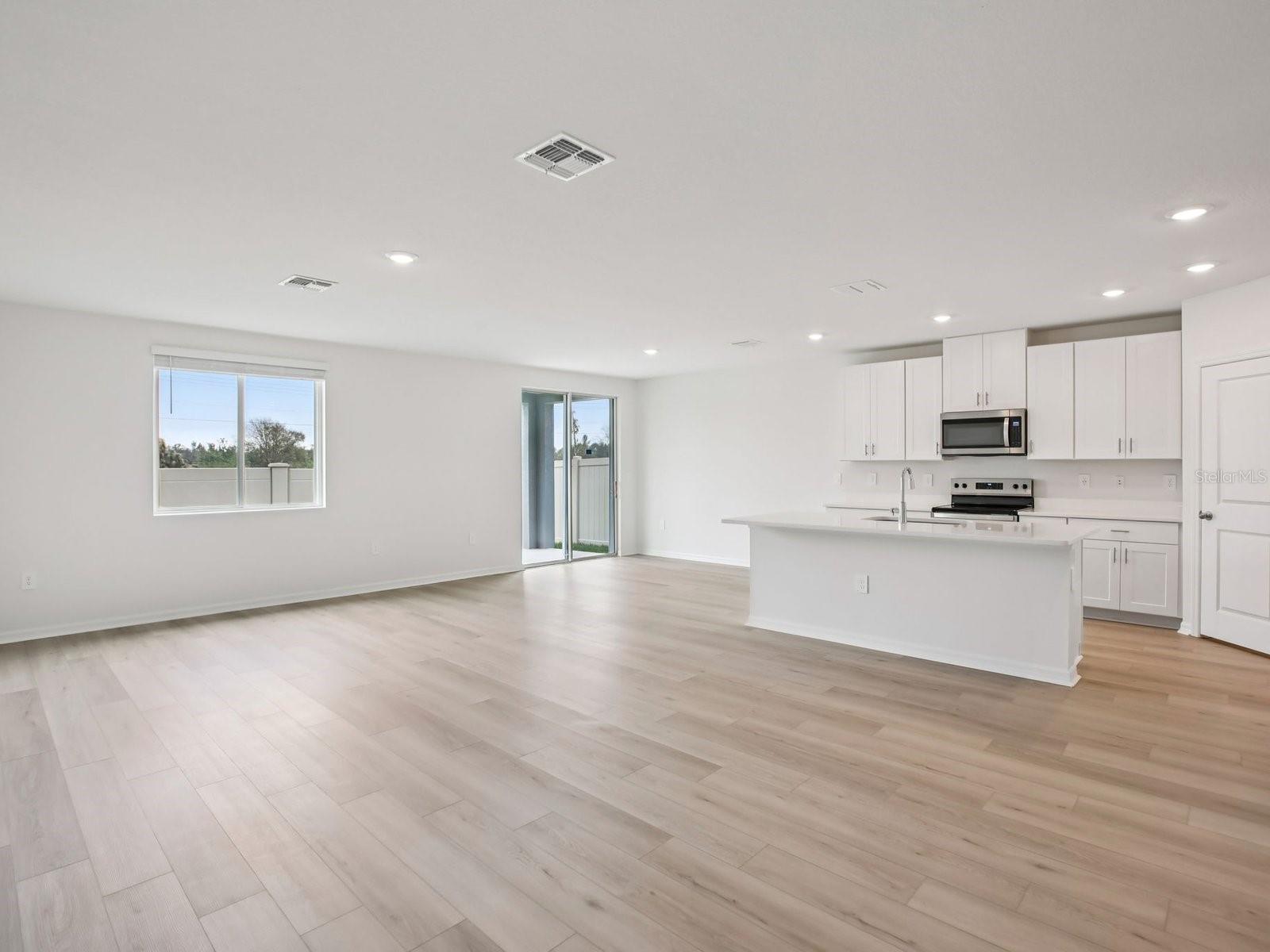 Interior photos are not of the actual home but are photos of the builder home with the same floorplan with similar interior finishes and features. - 10436 ABUNDANCE GROVE WAY, PARRISH