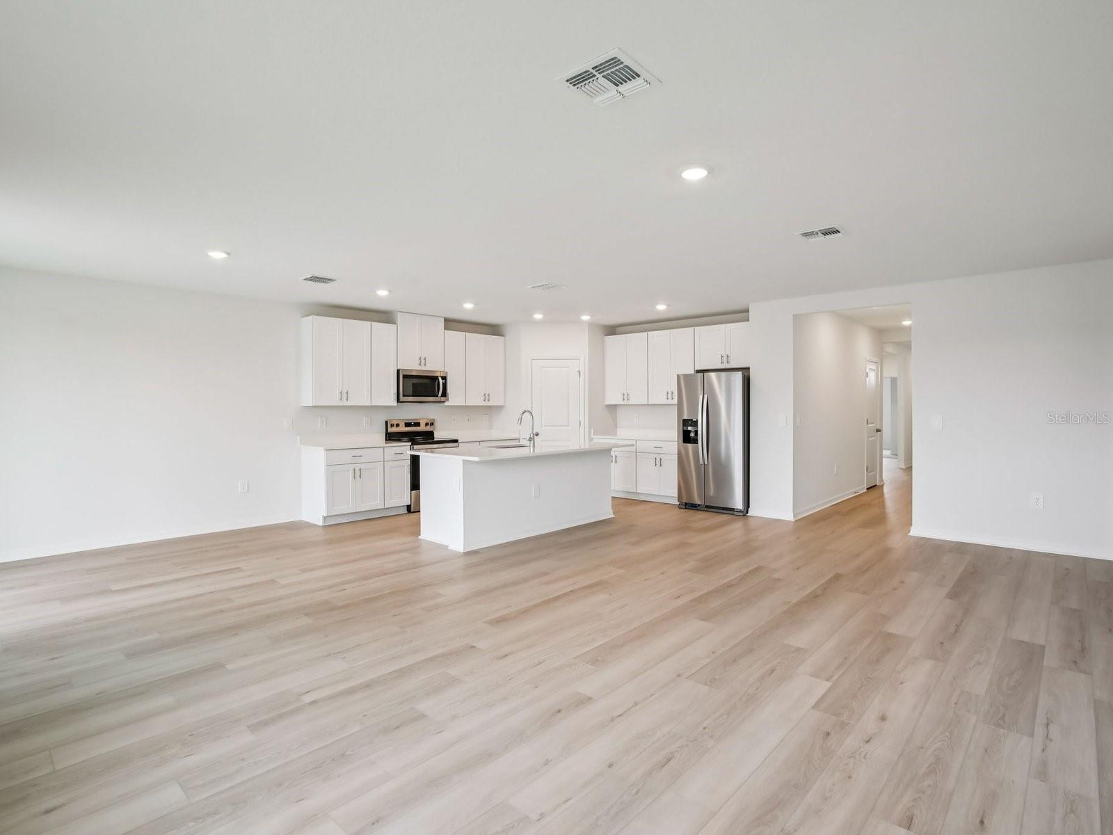 Interior photos are not of the actual home but are photos of the builder home with the same floorplan with similar interior finishes and features. - 10436 ABUNDANCE GROVE WAY, PARRISH
