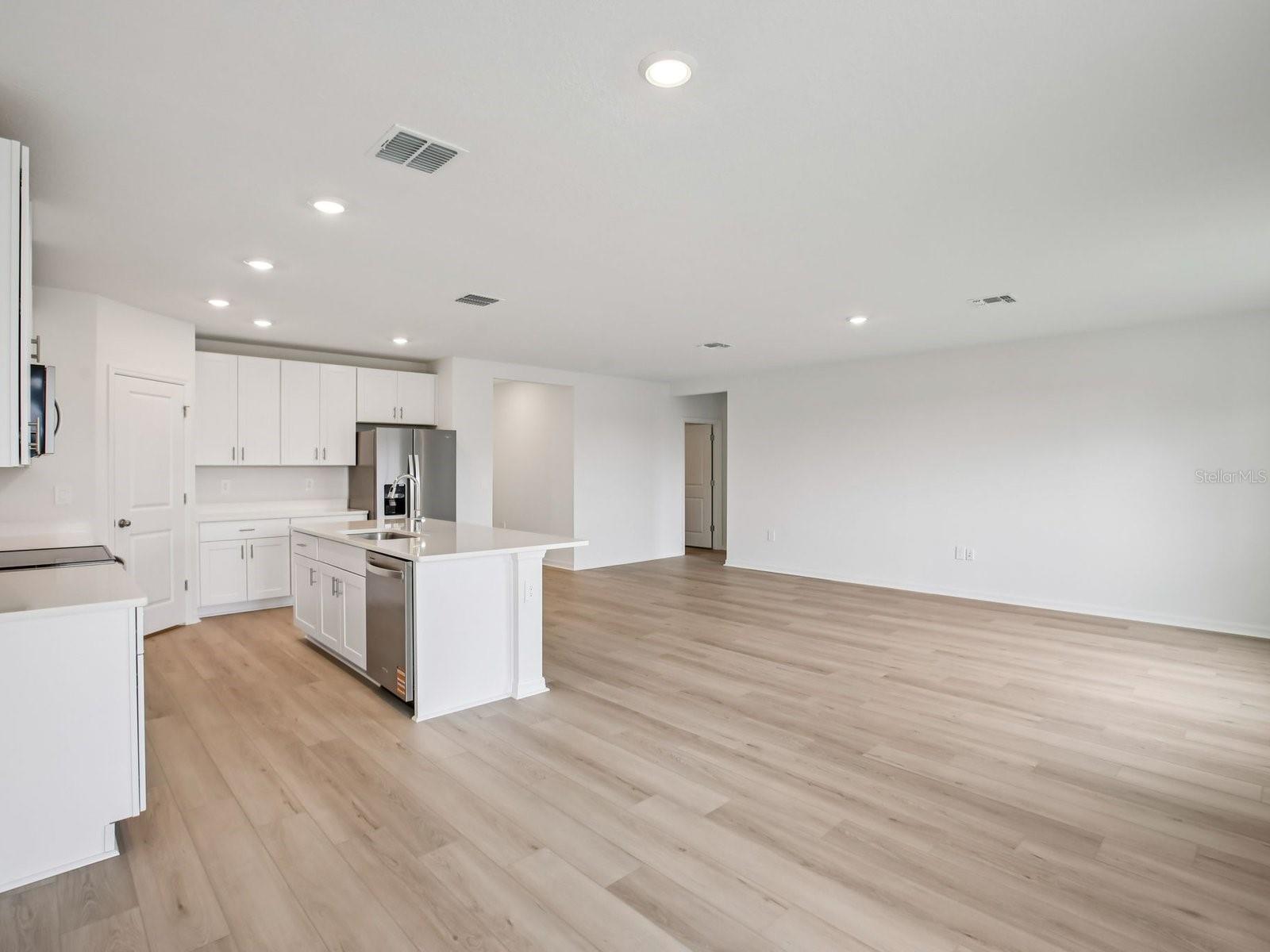 Interior photos are not of the actual home but are photos of the builder home with the same floorplan with similar interior finishes and features. - 10436 ABUNDANCE GROVE WAY, PARRISH