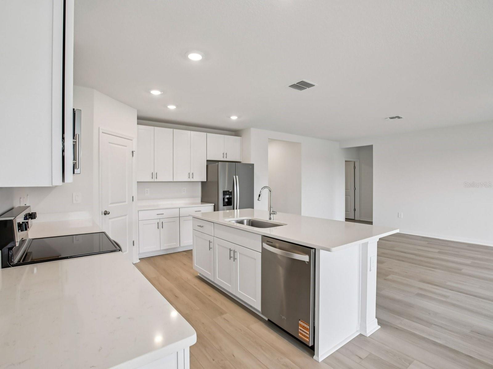 Interior photos are not of the actual home but are photos of the builder home with the same floorplan with similar interior finishes and features. - 10436 ABUNDANCE GROVE WAY, PARRISH