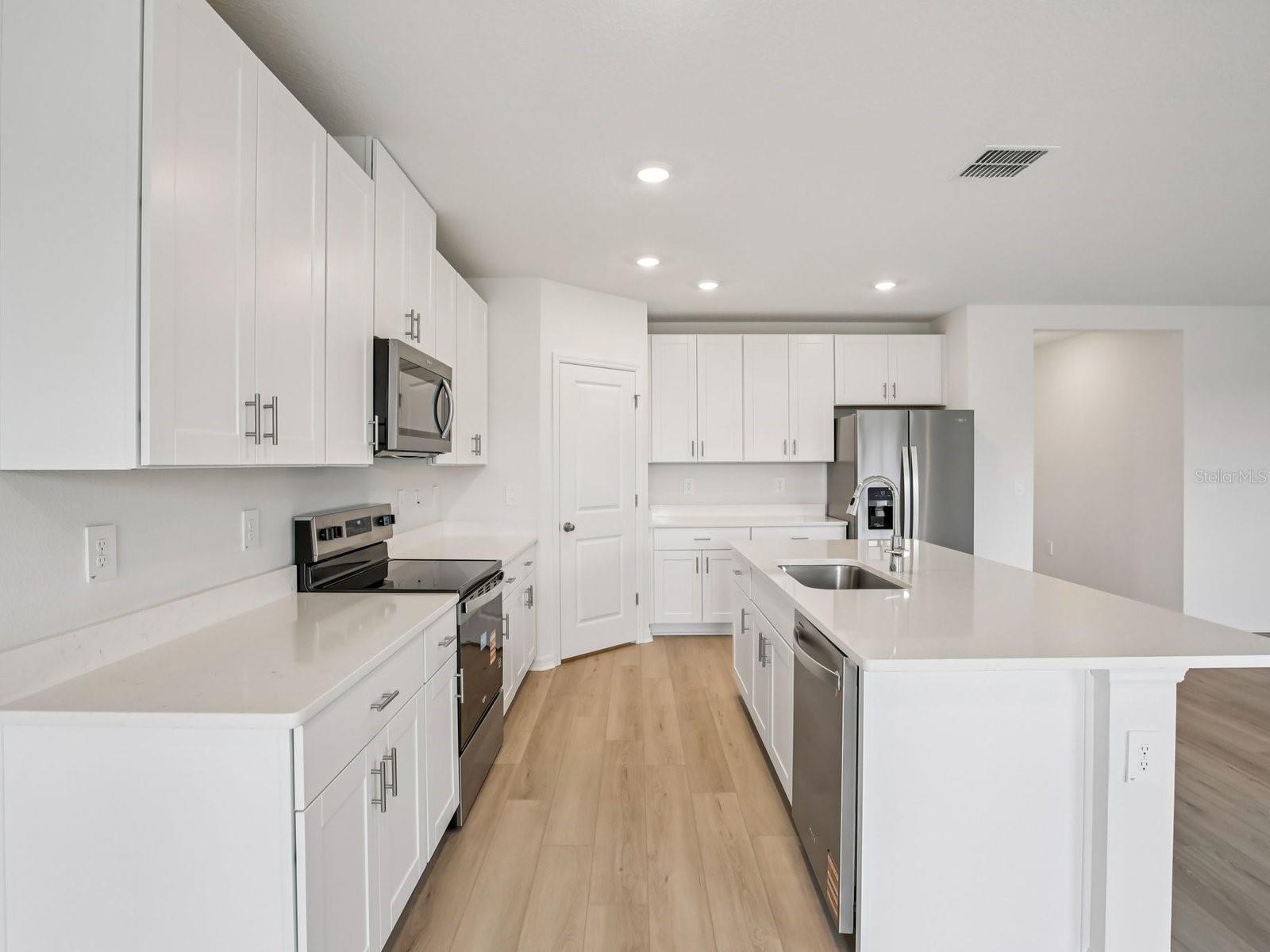 Interior photos are not of the actual home but are photos of the builder home with the same floorplan with similar interior finishes and features. - 10436 ABUNDANCE GROVE WAY, PARRISH
