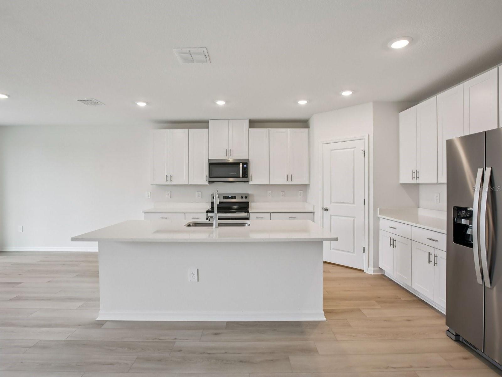 Interior photos are not of the actual home but are photos of the builder home with the same floorplan with similar interior finishes and features. - 10436 ABUNDANCE GROVE WAY, PARRISH
