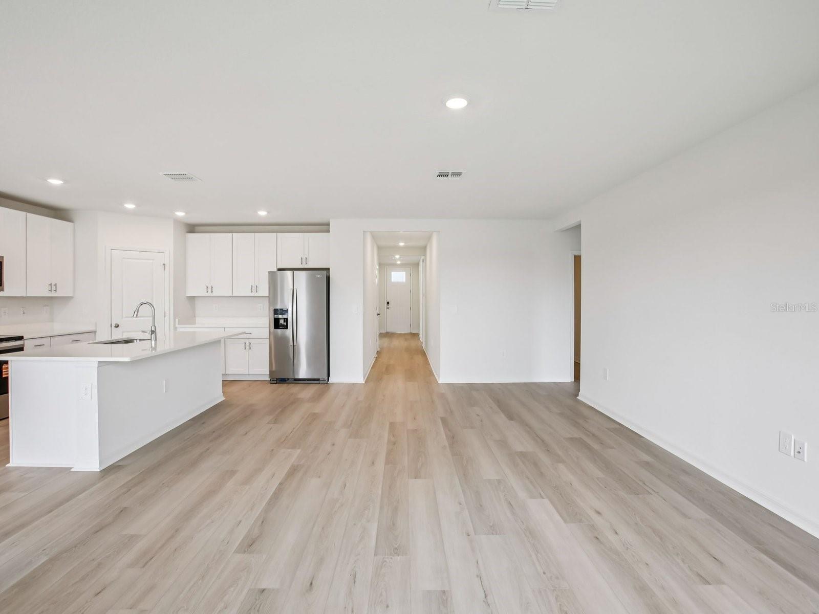 Interior photos are not of the actual home but are photos of the builder home with the same floorplan with similar interior finishes and features. - 10436 ABUNDANCE GROVE WAY, PARRISH