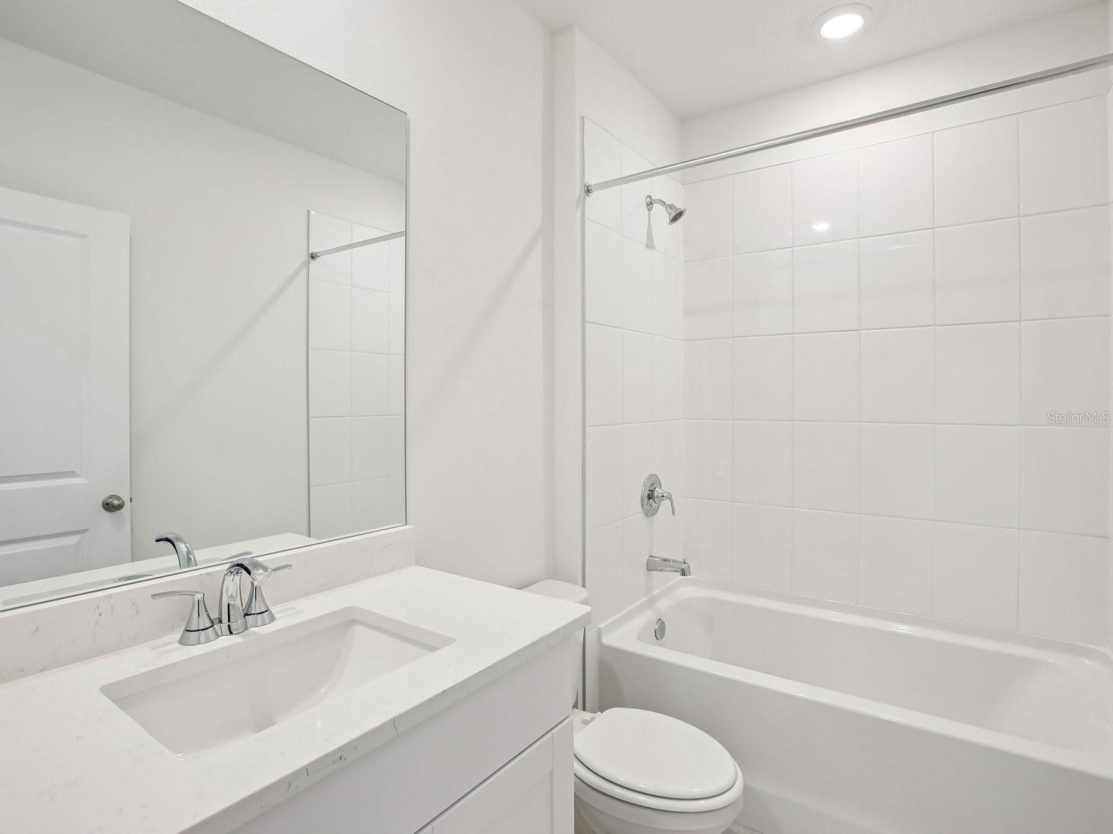 Interior photos are not of the actual home but are photos of the builder home with the same floorplan with similar interior finishes and features. - 10436 ABUNDANCE GROVE WAY, PARRISH