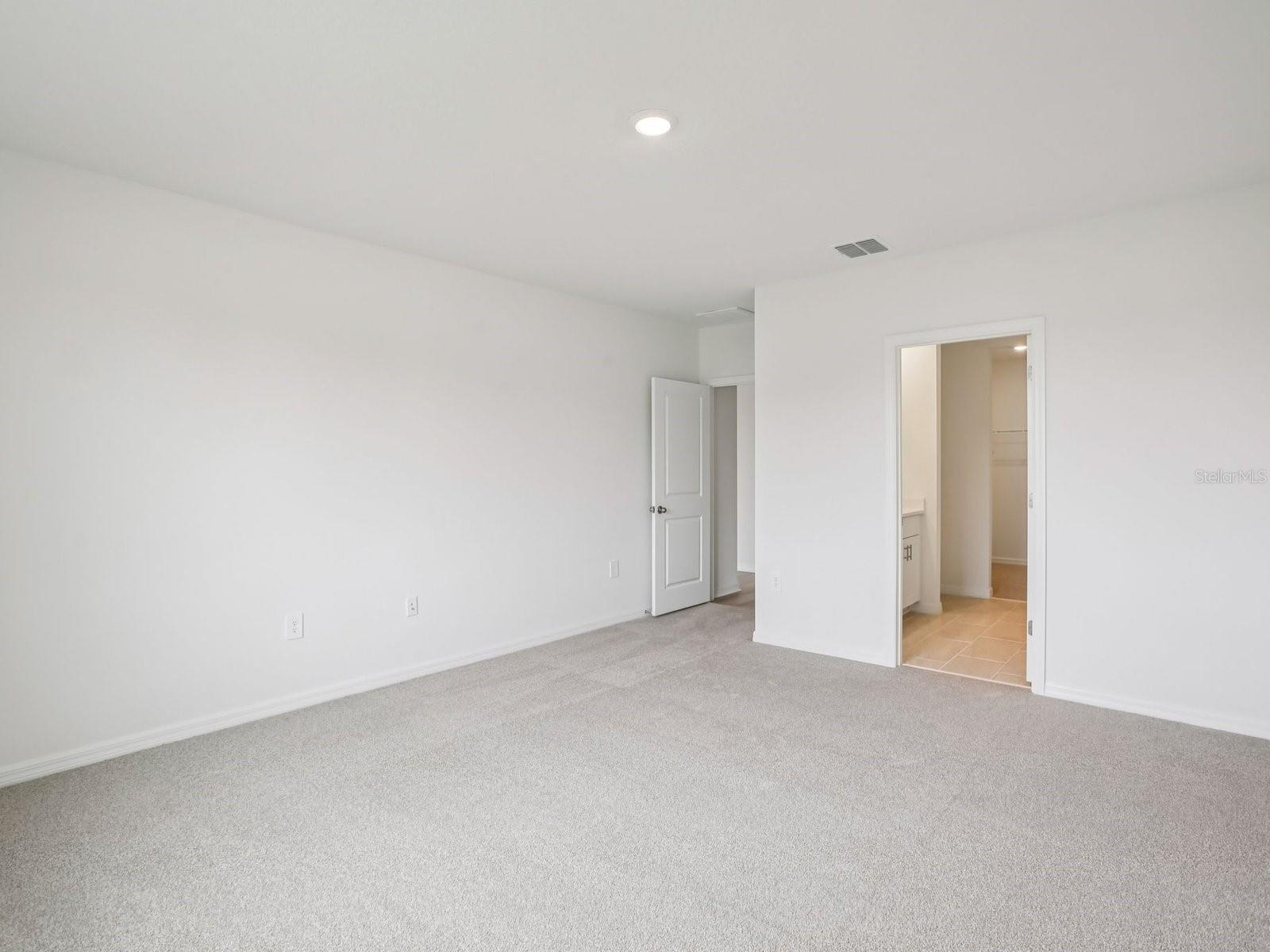 Interior photos are not of the actual home but are photos of the builder home with the same floorplan with similar interior finishes and features. - 10436 ABUNDANCE GROVE WAY, PARRISH